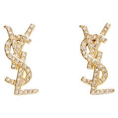 Saint Laurent Boucles oreilles Clous YSL Orecchini Cassandre in metallo dorato con borchie