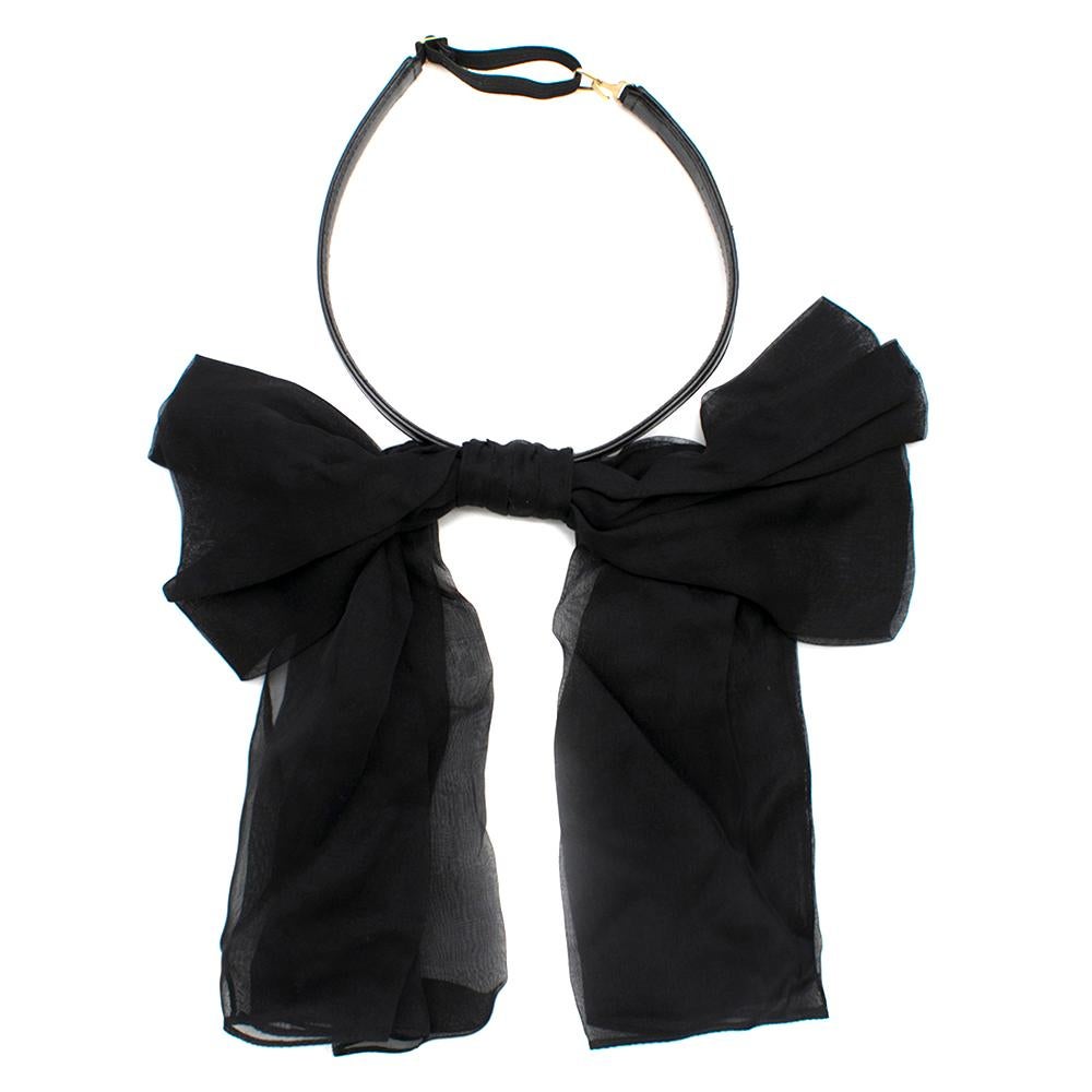 Saint Laurent Bow In Black Silk Muslin With Leather Collar

Black Silk Bow
Adjustable Collar
Metal Plaque With Engraved Saint Laurent Signature
Made in Italy

Please note, these items are pre-owned and may show some signs of storage, even when