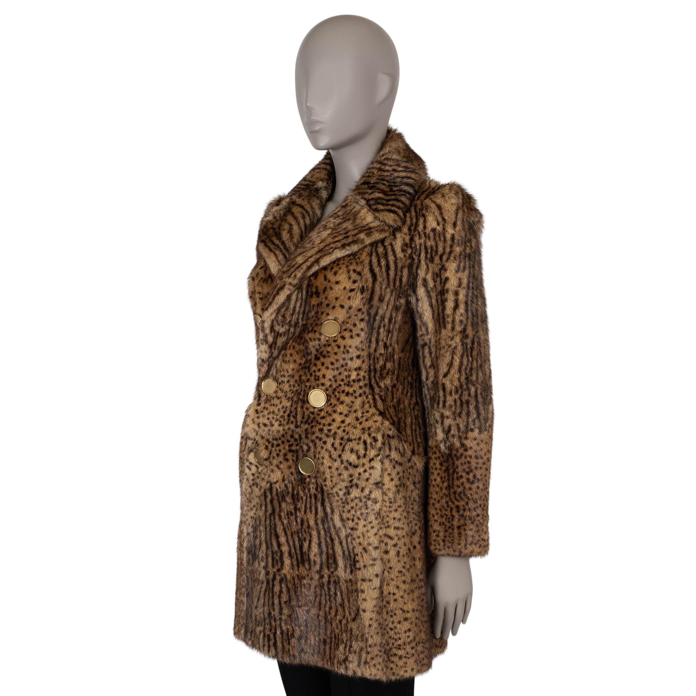 This 100% authentic Saint Laurent fur coat in beige and black ocelot-printed marmot fur exudes vintage-inspired glamour with a modern edge. Designed with a fitted, double-breasted silhouette, it features sharp notched lapels, two slit pockets, and a