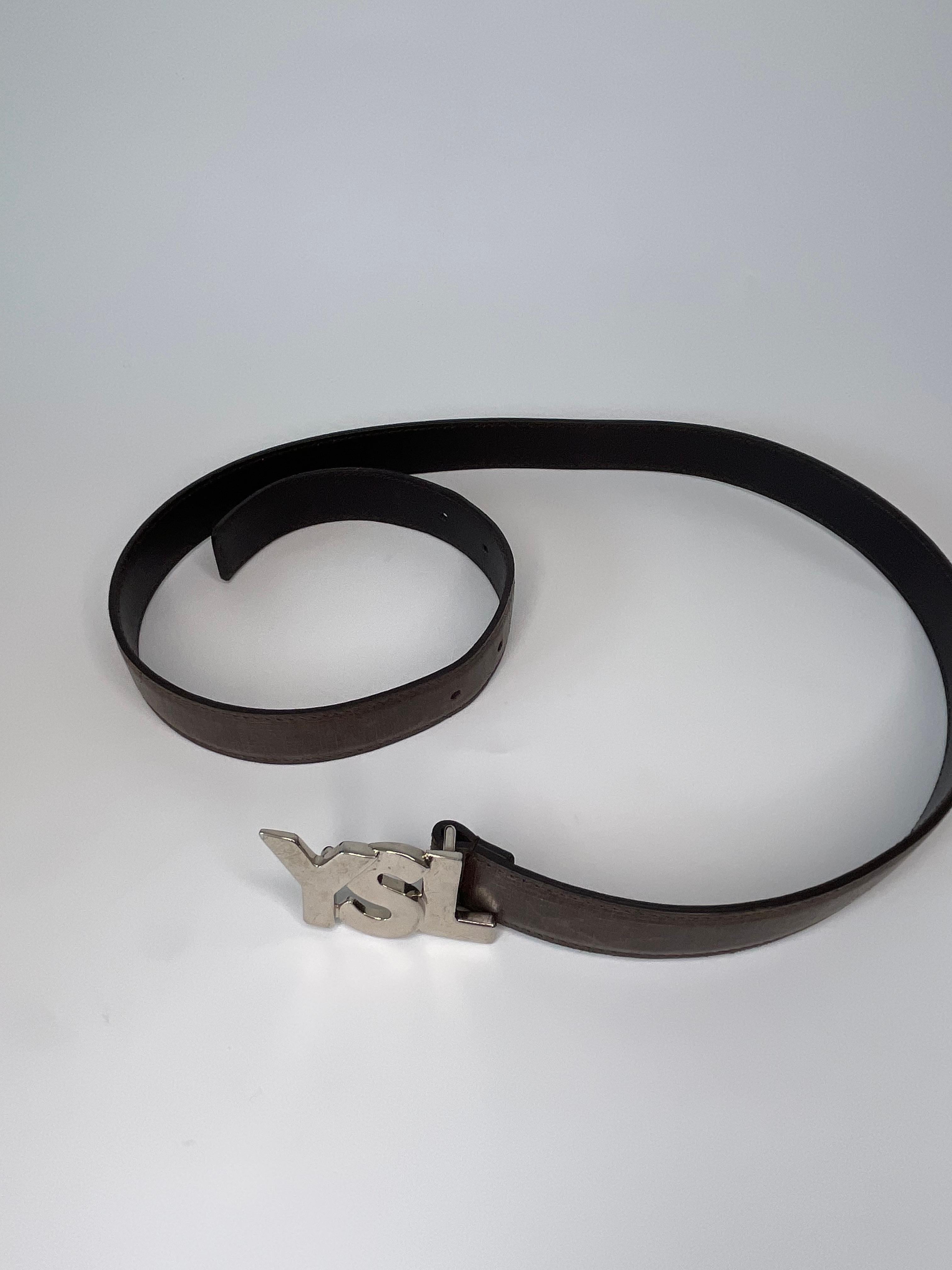 YSL brown leather belt with with silver-tone hardware. YSL logo on the buckle, item in good condition. 

COLOR: Brown with silver buckle
MATERIAL: Leather
DATE CODE: 274610
SIZE: 85/34
EST. RETAIL: $700.00
COMES WITH: Dust bag, original