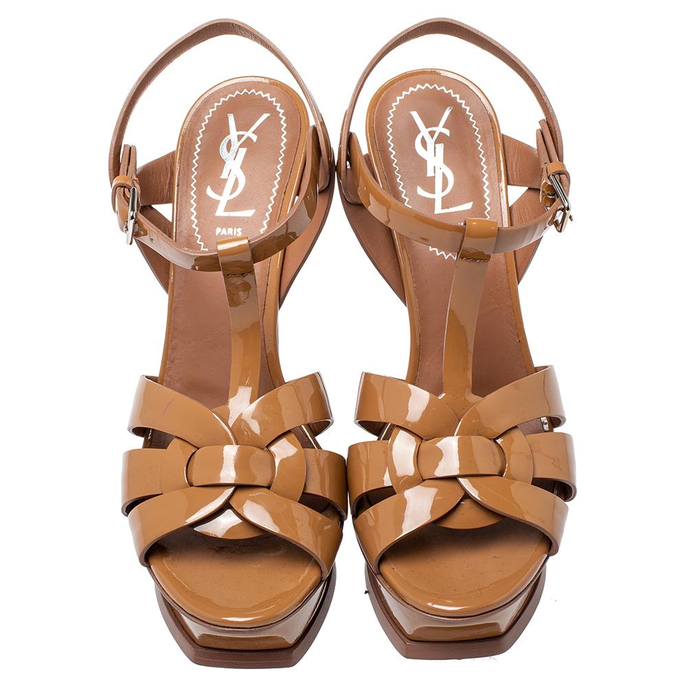 One of the most sought-after designs from Saint Laurent is their Tribute sandals. They are such a craze amongst fashionistas around the world, and it is time you own one yourself. These brown-hued ones are designed with glossy patent leather into a