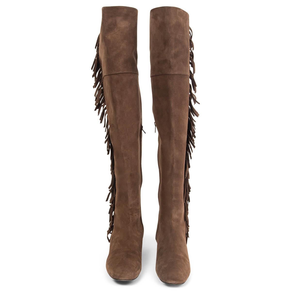 100% authentic Saint Laurent BB 20 Fringed Over The Knee Boots in brown suede with a round toe. Open with a zipper on the inside and have a elastic band at top circumference. Has been worn and are in excellent condition. Come with dust bag.