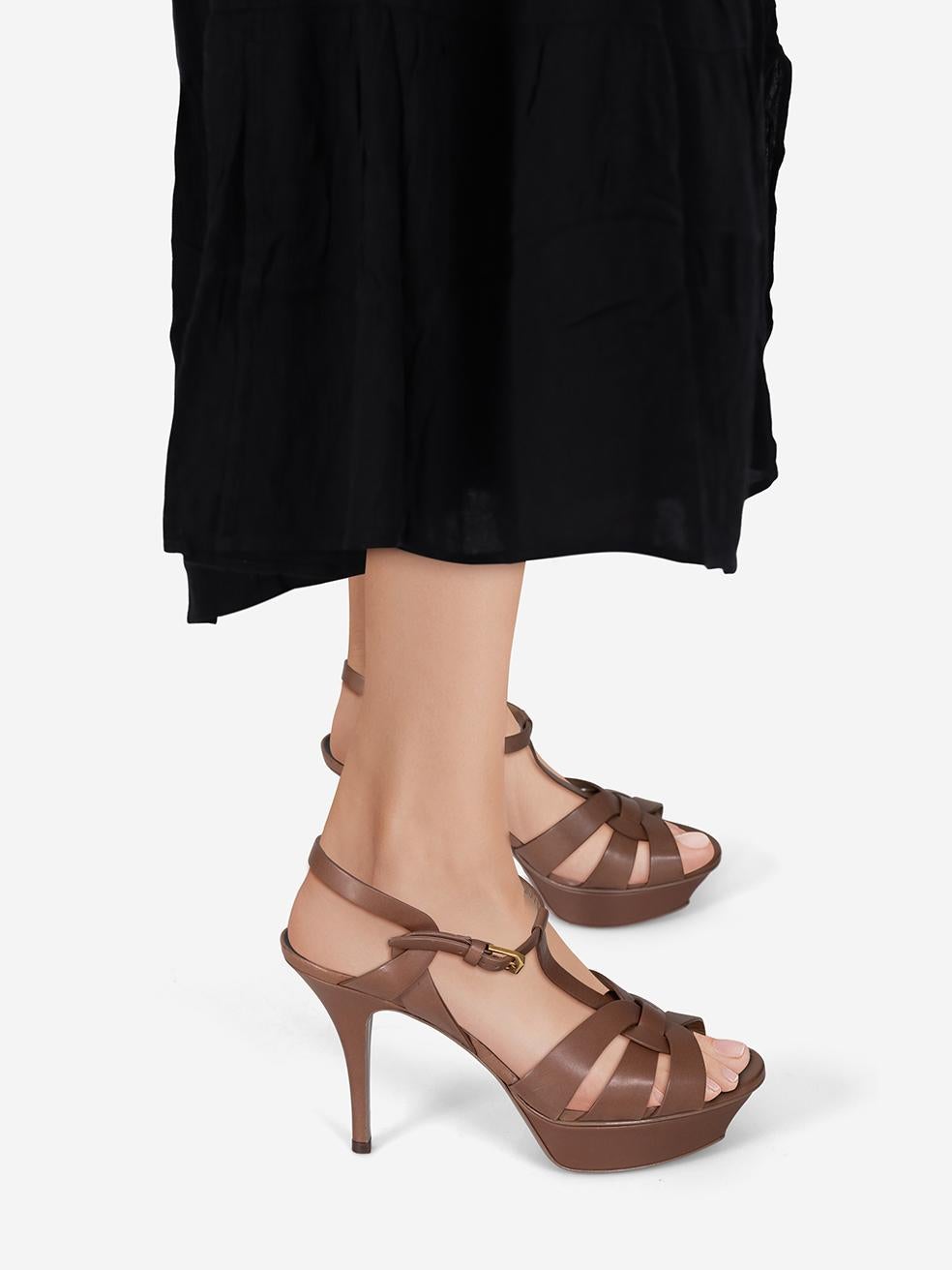 CONDITION is Very good. Minimal wear to the sandals is evident. Mark on the right side of the right ankle strap. Abrasion on both platforms, right side of the left ankle strap and the toe strap on the right shoe on this used Saint Lauren designer