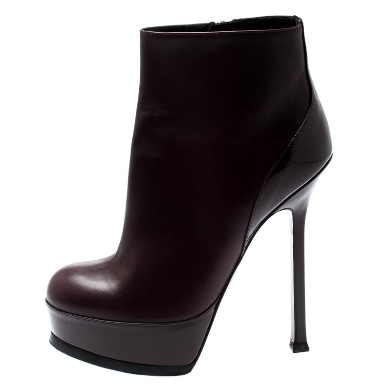 Fashioned by Saint Laurent, these ankle booties are for fashionable souls like you. Constructed using burgundy leather, they feature side zippers, platforms, and 13.5cm heels. The sleek shape gives them the extra touch of style.

Includes: Original
