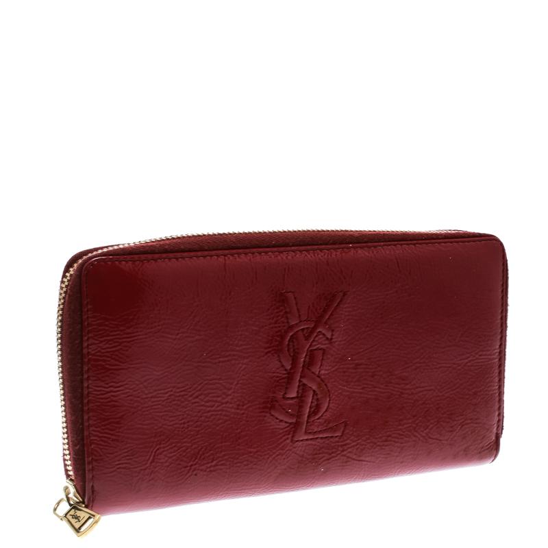 Plunge in love with this extremely fashionable patent leather wallet with charming features. It has a burgundy shade, and on the front, there is the signature YSL logo. The wallet has multiple slots and a zipped compartment, all secured by a