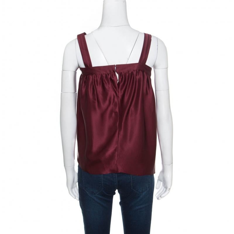 Look every part the fashionista in this Saint Laurent top that was created from the finest silk. Designed as a sleeveless with a bow detail and pleats, this burgundy top is versatile and can be worn with pencil skirts and trousers.

Includes: The