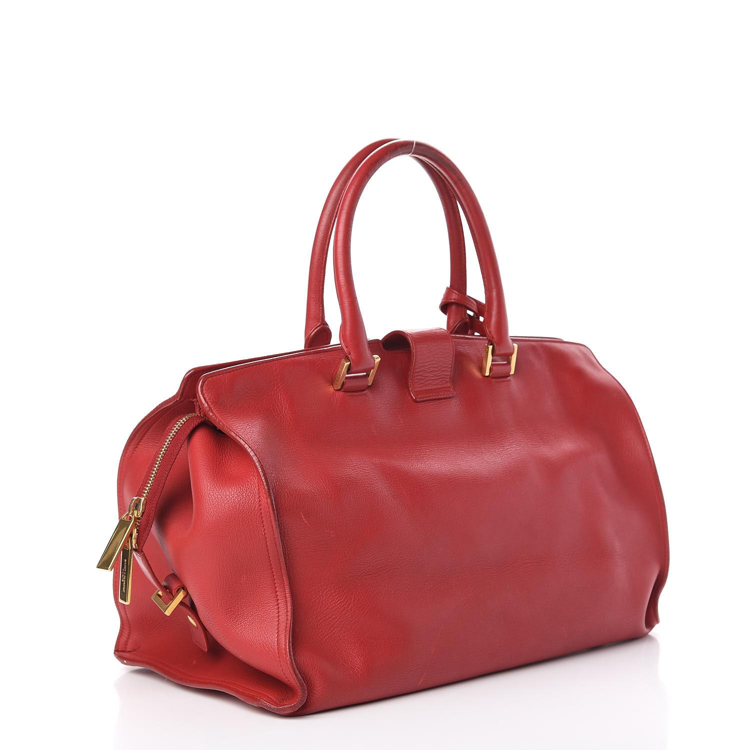 Color:  Red
Material: Leather
Model No.: 311208
Measures: Height 10” x Length 14.25” x Depth 6.5”
Drop: 5.5” (top handle) & 18” (strap)
Condition: Good. Light scratches and marks throughout.

Made in Italy