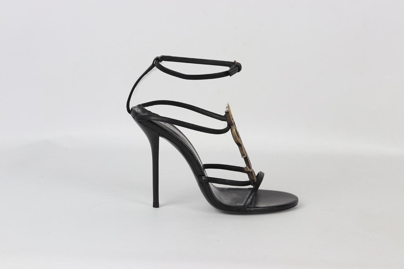 Saint Laurent Cassandra logo embellished leather sandals. Black. Buckle fastening at side. Does not come with dustbag or box. Size: EU 38 (UK 5, US 8). Insole: 9.5 in. Heel Height: 4 in. Platform: 0.2 in. Used. Very good condition - Worn once. Light