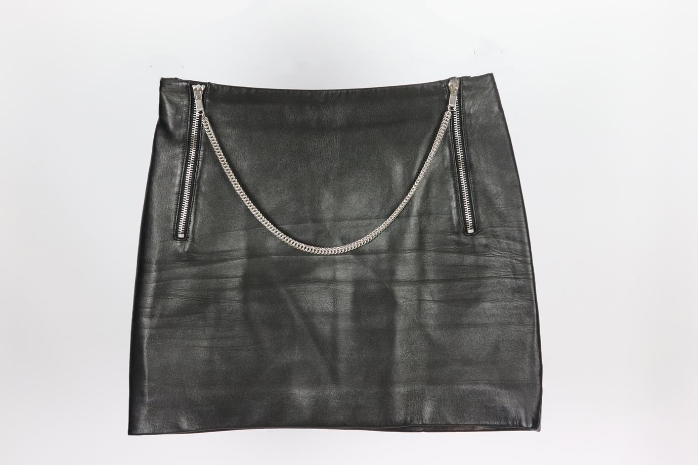 Saint Laurent chain detailed leather mini skirt. Black. Zip fastening at front. 100% Leather; lining: 55% cupro, 45% cotton. Size: FR 36 (UK 8, US 4, IT 40). Waist: 27 in. Hips: 34 in. Length: 14.5 in. Very good condition - Light signs of wear; see