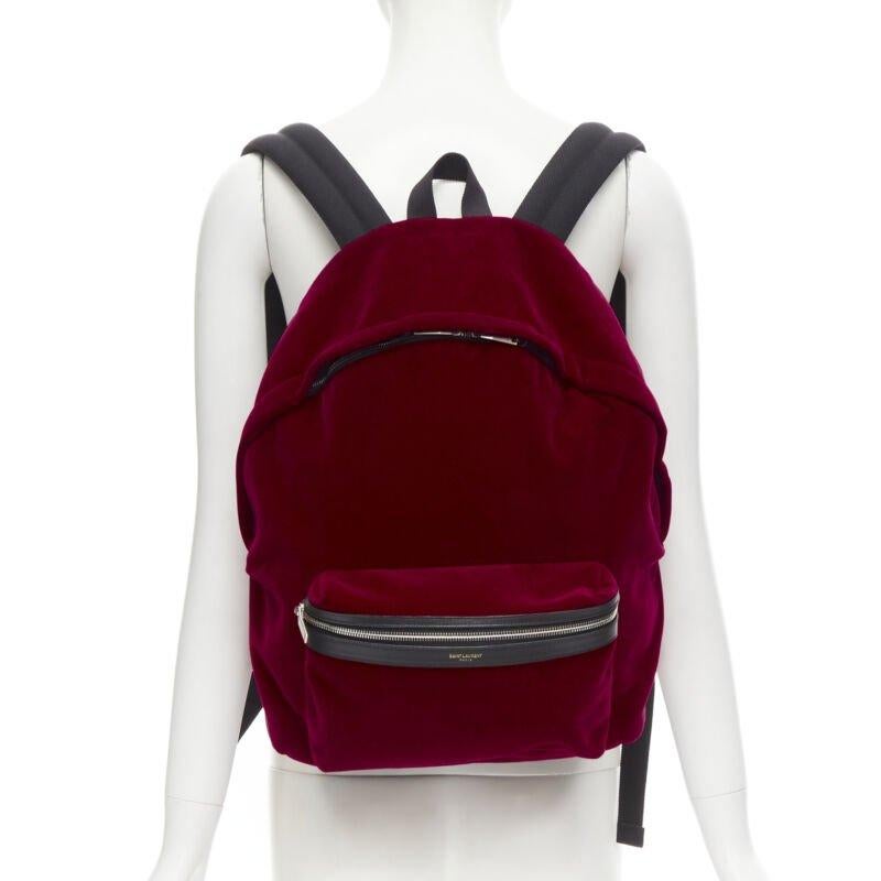 SAINT LAURENT City red velvet black leather trim backpack
Reference: MELK/A00185
Brand: Saint Laurent
Designer: Anthony Vaccarello
Model: City Velvet
Material: Velvet, Leather
Color: Red, Black
Pattern: Solid
Closure: Zip
Lining:  Fabric
Extra