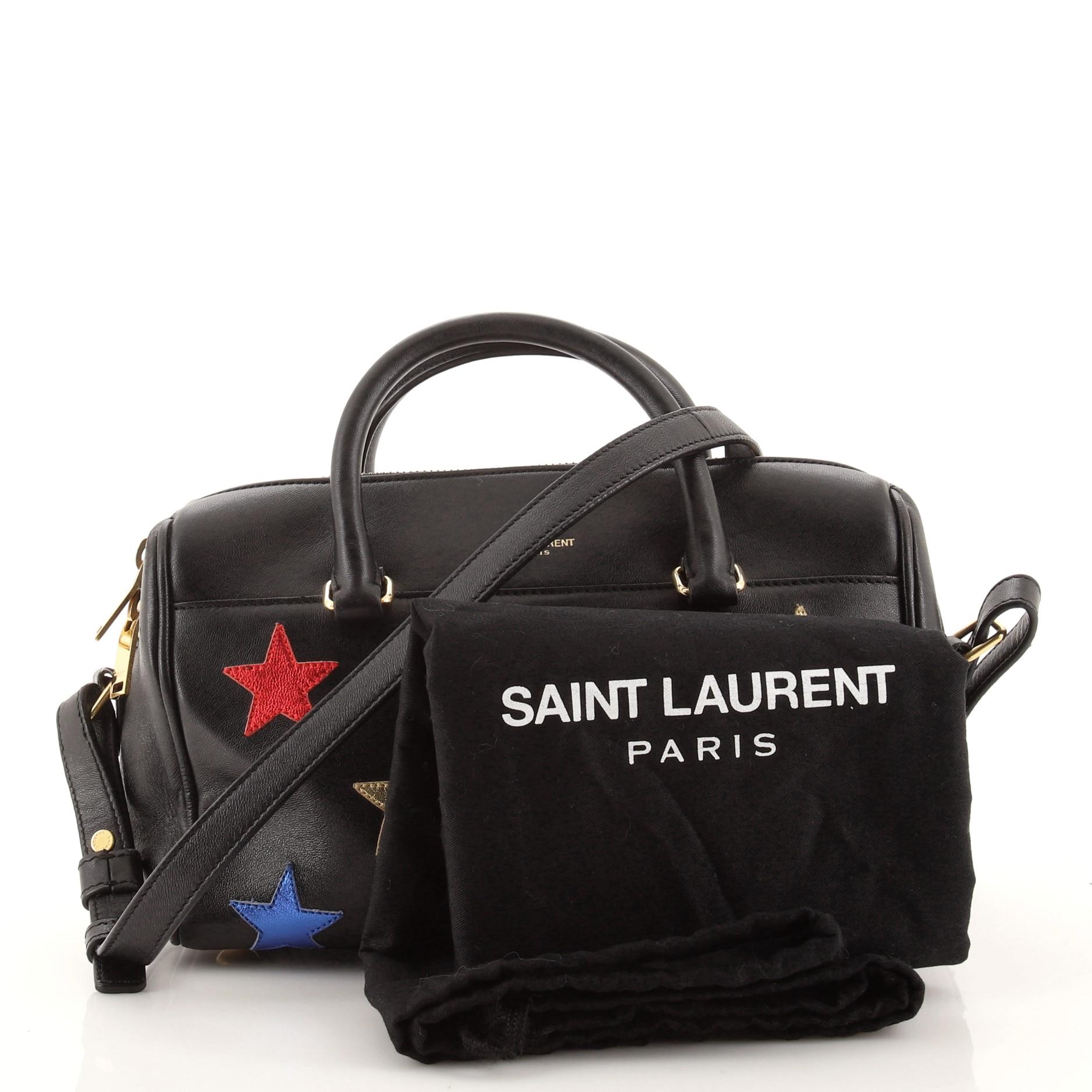 Condition: Good. Odor in interior. Creasing and scuffs on exterior, moderate wear on base corners and in interior, indentations on handles. Creasing on strap, scratches and discoloration on hardware.
Accessories: Dust Bag, With Strap
Measurements: