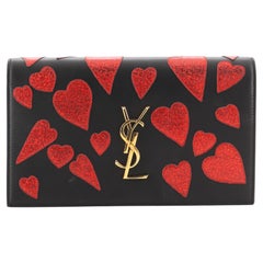 Saint Laurent Klassische Monogramm-Clutch aus Leder mit Patchwork