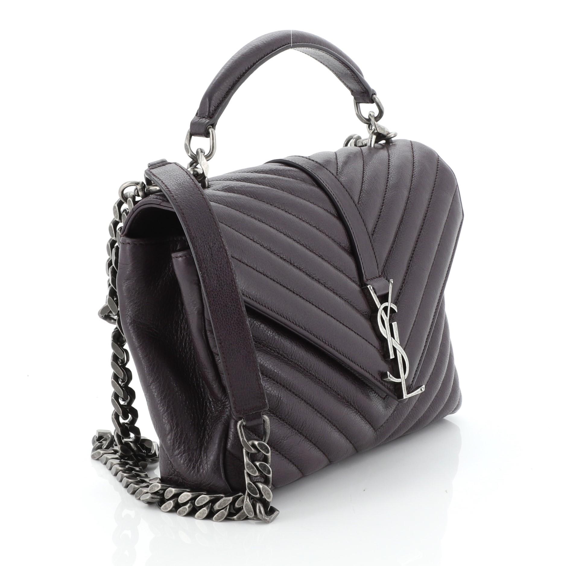 This Saint Laurent Classic Monogram College Bag Matelasse Chevron Leather Medium, crafted in purple matelasse chevron leather, features a single top handle, exterior back pocket, and aged silver-tone hardware. Its magnetic snap closure opens to a