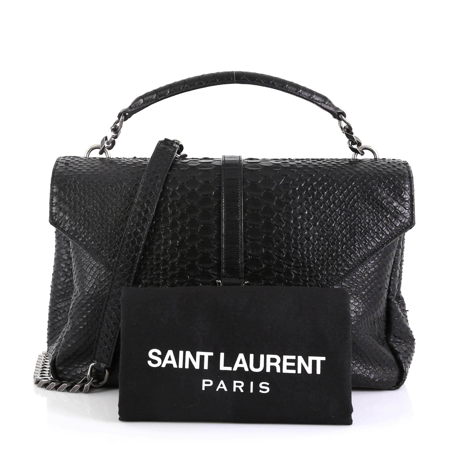 This Saint Laurent Classic Monogram College Bag Python Embossed Leather Large, crafted in black python embossed leather, features a single top handle, exterior back pocket, and aged silver-tone hardware. Its magnetic snap closure opens to a black