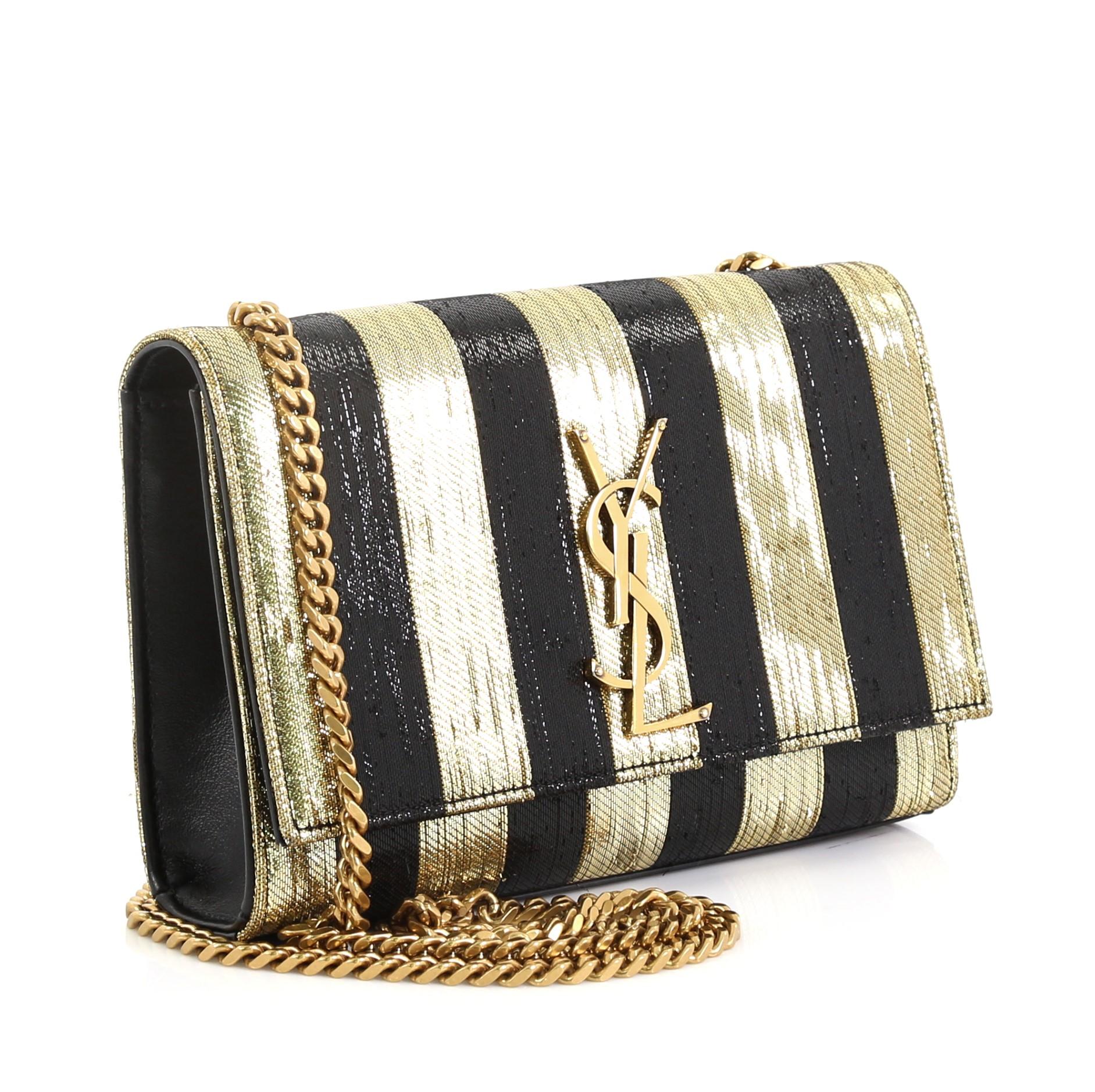 This Saint Laurent Classic Monogram Crossbody Bag Sequins Small, crafted in metallic black and gold leather with multicolor sequins, features gourmette chain strap, interlocking YSL logo at its center, and gold-tone hardware. Its magnetic snap