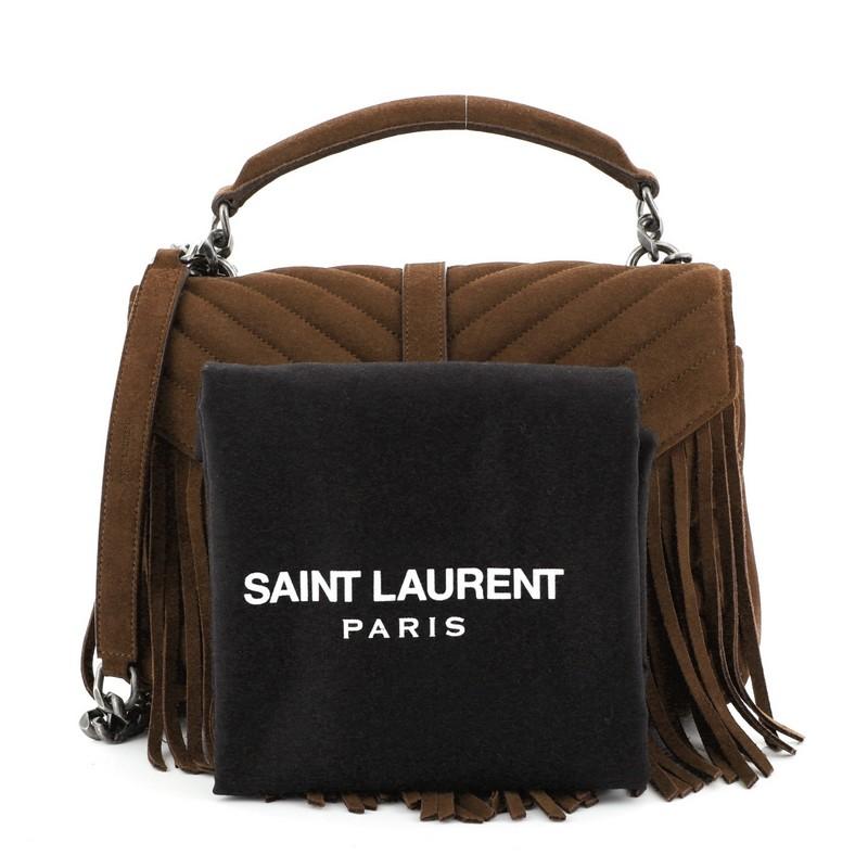 This Saint Laurent Classic Monogram Fringe College Bag Matelasse Suede Medium, crafted in brown matelasse suede, features a single top handle, exterior back pocket, YSL metal logo at the front, fringe detail and aged silver-tone hardware. Its