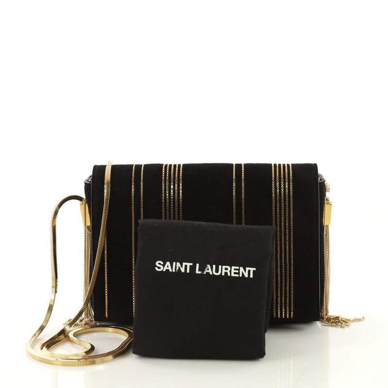 This Saint Laurent Classic Monogram Side Tassel Crossbody Bag Embellished Suede Small, crafted in black embellished suede, features chain link strap, interlocking YSL logo at its flap, side tassels, and gold-tone hardware. Its magnetic strap closure