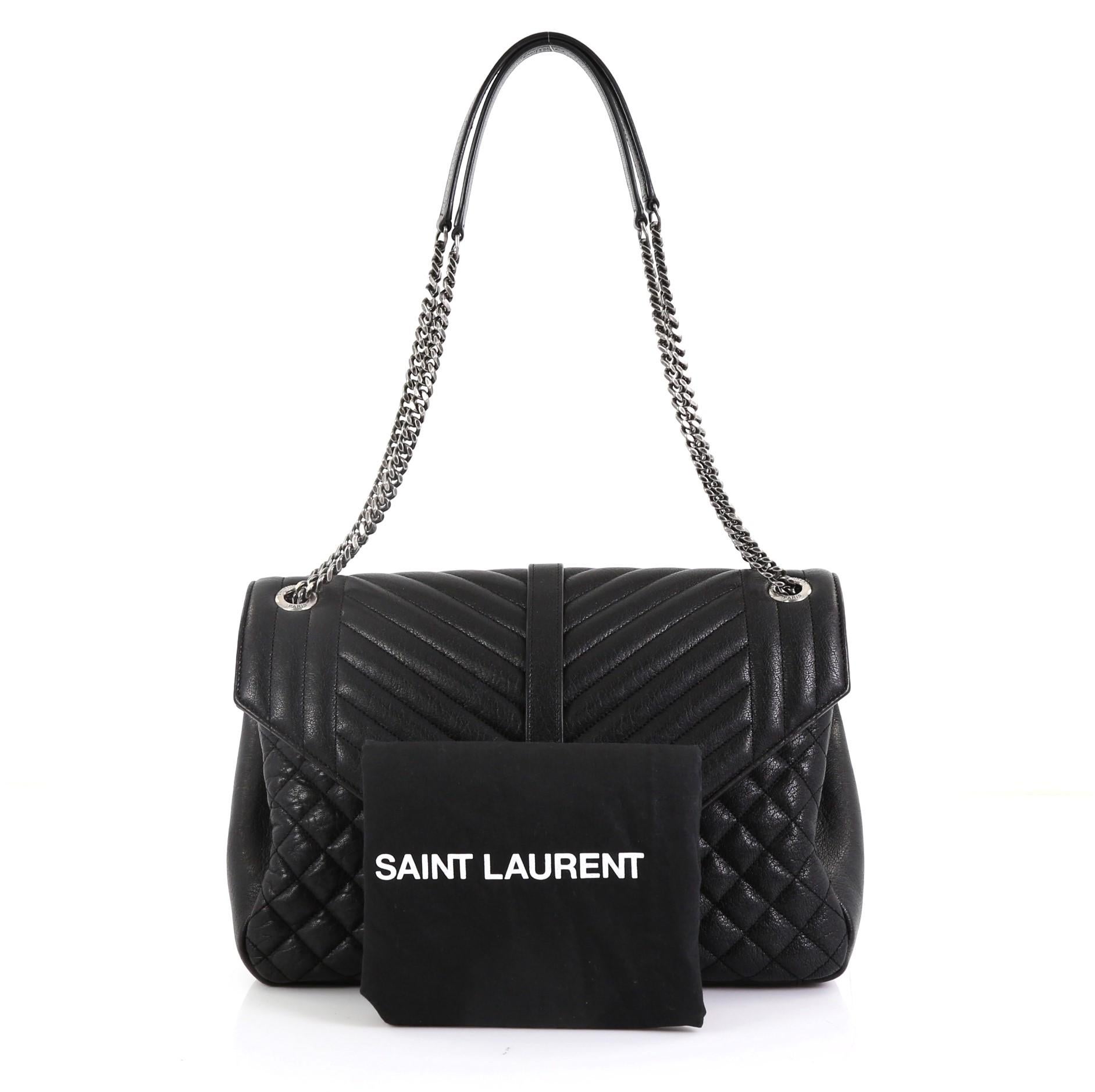 This Saint Laurent Classic Monogram Slouchy Envelope Satchel Quilted Leather Large, crafted from black quilted leather, features dual chain-link shoulder straps with leather pads, YSL monogram logo at the front, and aged silver-tone hardware. Its