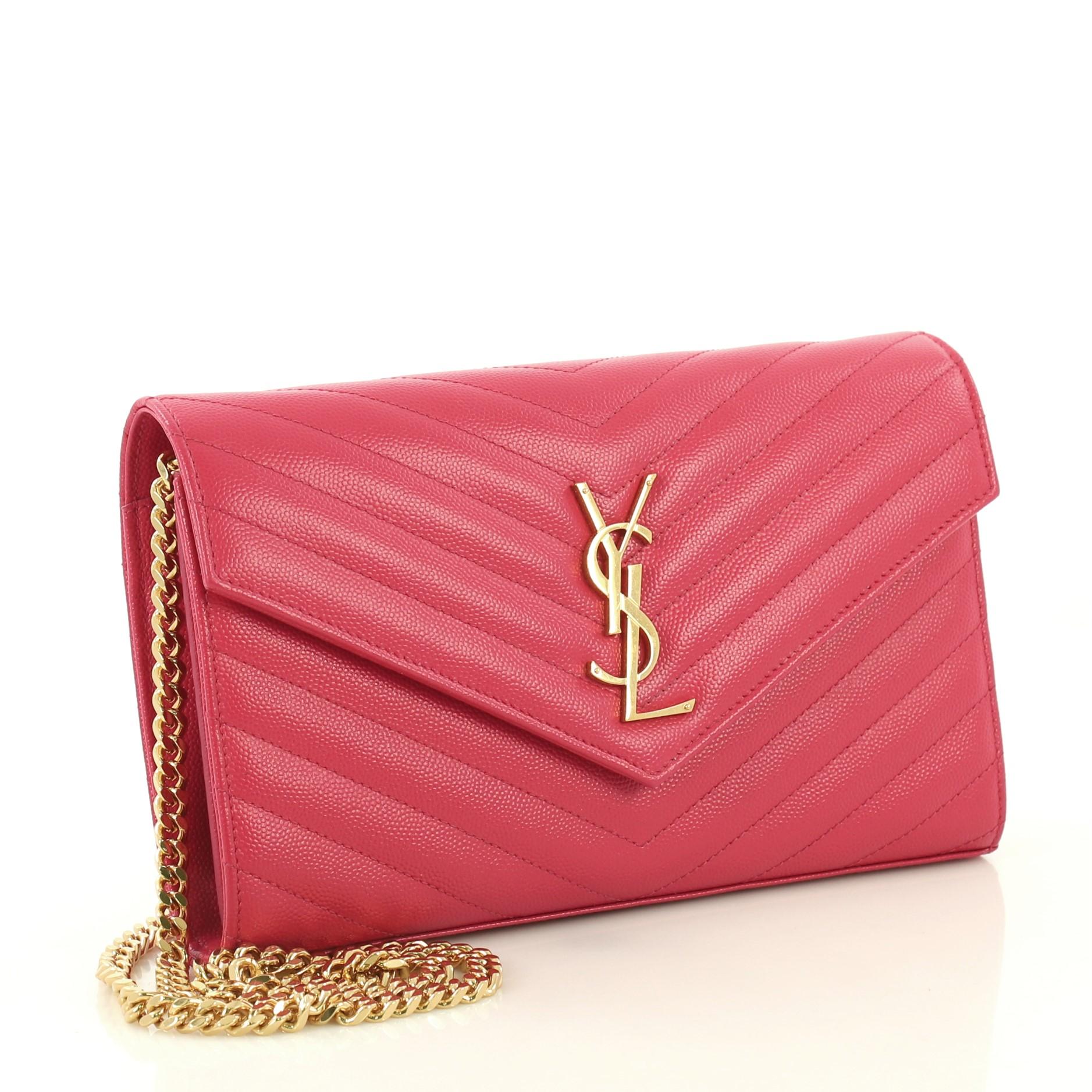 This Saint Laurent Classic Monogram Wallet on Chain Matelasse Chevron Leather Medium, crafted from pink matelasse chevron leather, features chain link strap, YSL monogram logo at the front, and gold-tone hardware. Its hidden magnetic snap closure