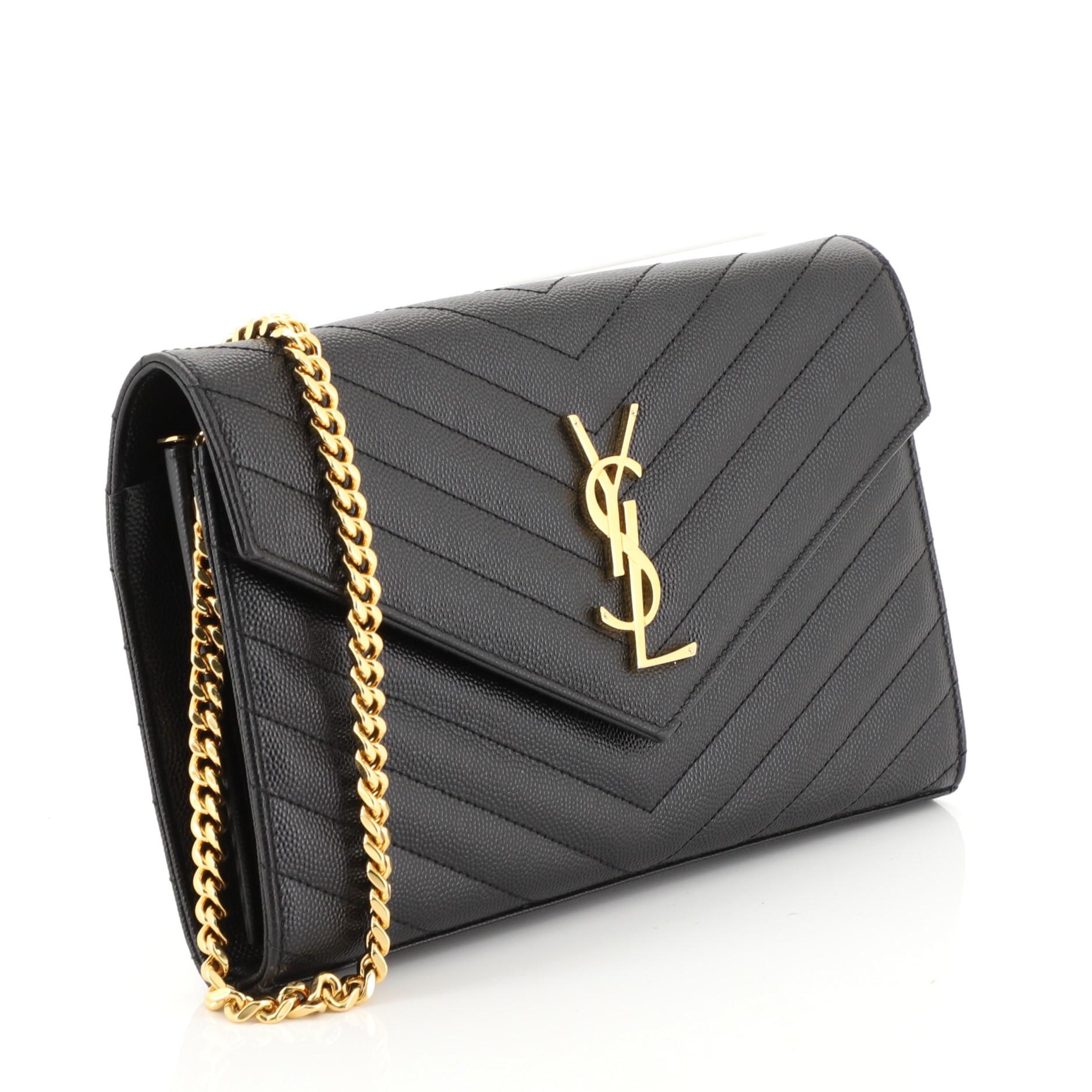 This Saint Laurent Classic Monogram Wallet on Chain Matelasse Chevron Leather Medium, crafted from black matelasse chevron leather, features chain link strap, YSL monogram logo at the front, and gold-tone hardware. Its hidden snap closure opens to a