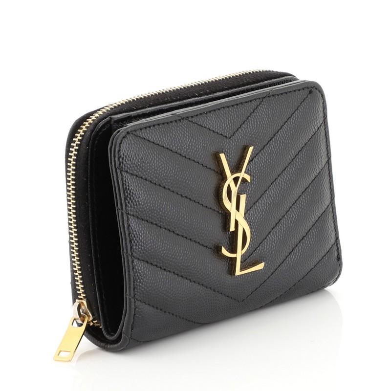 This Saint Laurent Classic Monogram Zip Around Wallet Matelasse Chevron Leather Compact, crafted from black matelasse chevron leather, features YSL monogram logo at the front, snap button-fastening section with multiple interior card slots and bill