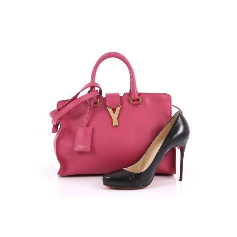 This authentic Saint Laurent Classic Y Cabas Leather Small is an impeccably chic bag perfect for everyday use. Crafted from pink leather, this stand-out, minimalist satchel features dual-rolled leather handles, signature Yves Saint Laurent's 'Y' top