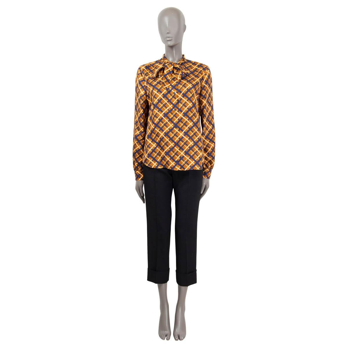 100% authentic Saint Lauren self-tie blouse in silk (100%) with retro print in copper, camel and blue. Closes with buttons, buttoned arms and a front self-tie. Has been worn and is in excellent condition. 

Measurements
Tag Size	42
Size	L
Shoulder