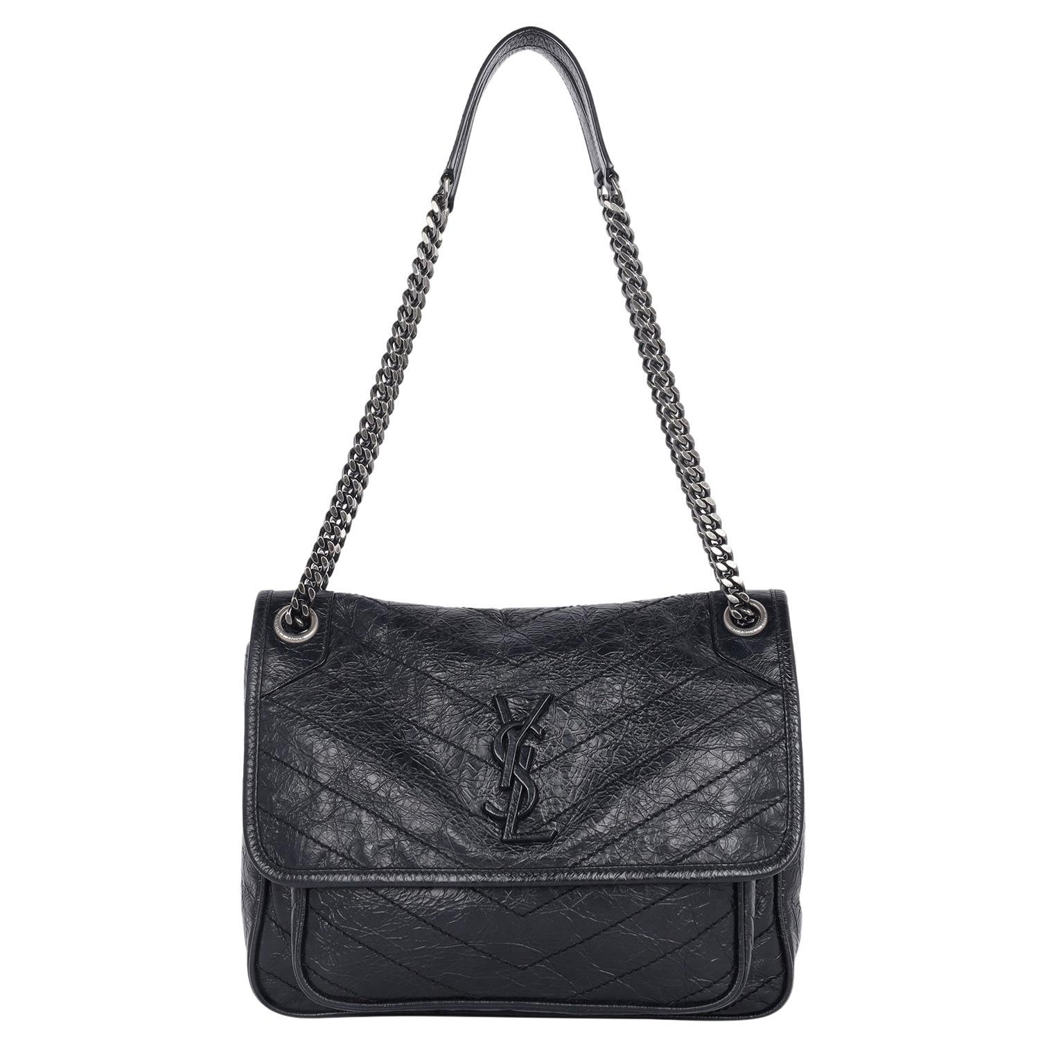 Authentic Preowned Crinkled Calfskin Leather Monogram Black Medium Niki Chain Satchel.

This elegant shoulder bag features crinkled distressed, chevron-quilted calfskin leather in black, front flap magnetic snap closure with YSL logo, rear slip