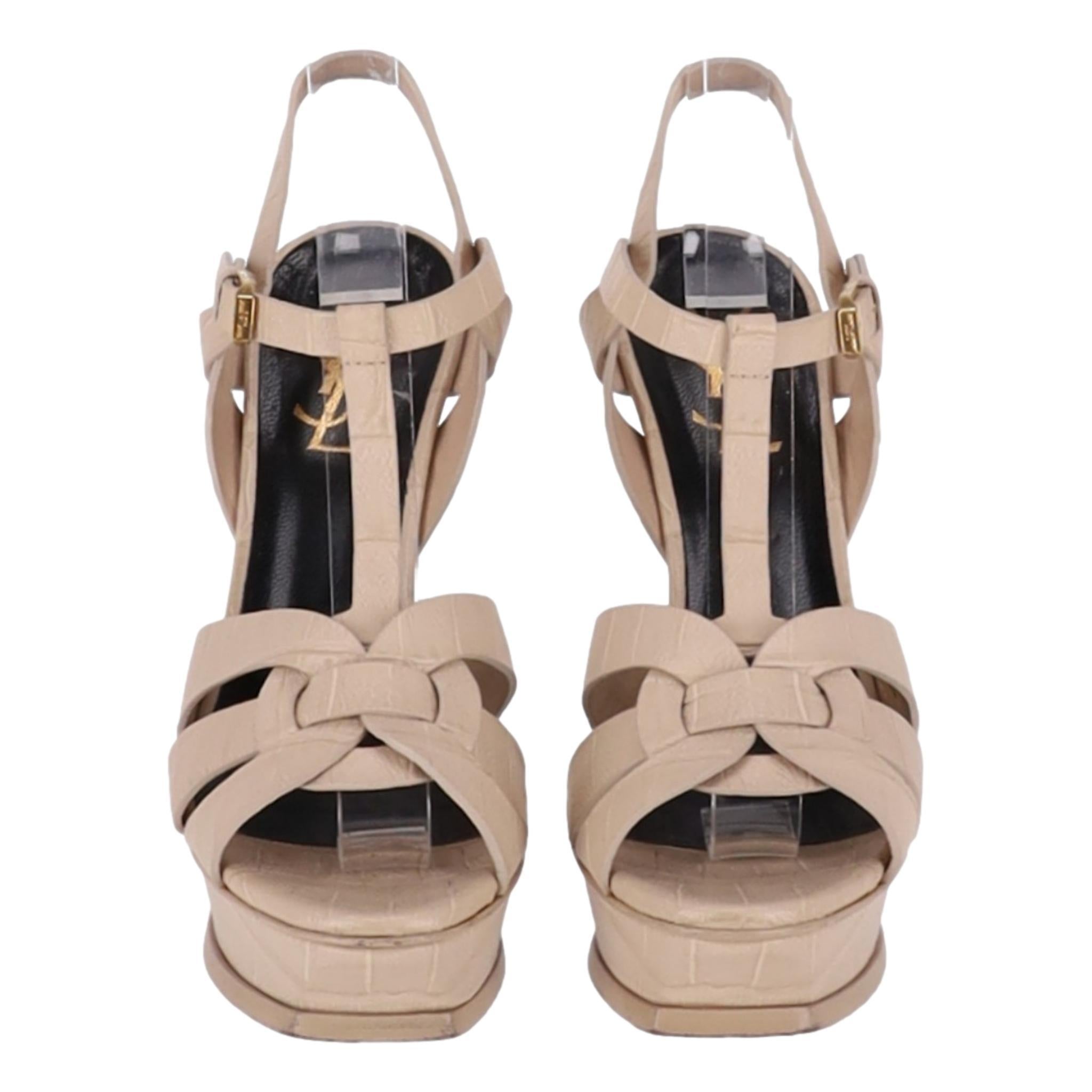 Saint Laurent Croc Embossed Leather Tribute Platform Sandals

Nude heels with caged strap design to the vamp and buckle strap ankle closure.

Featuring square toe, platform and high stiletto heel.

Having leather lining and soles.

Size –