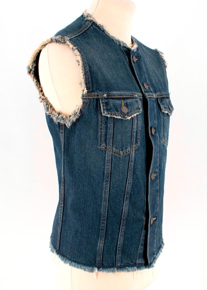 Saint Laurent Cutoff Jeans Jacket

- Raw hems
- Collarless
- Two front pockets
-Sleeveless

Please note, these items are pre-owned and may show signs of being stored even when unworn and unused. This is reflected within the significantly reduced