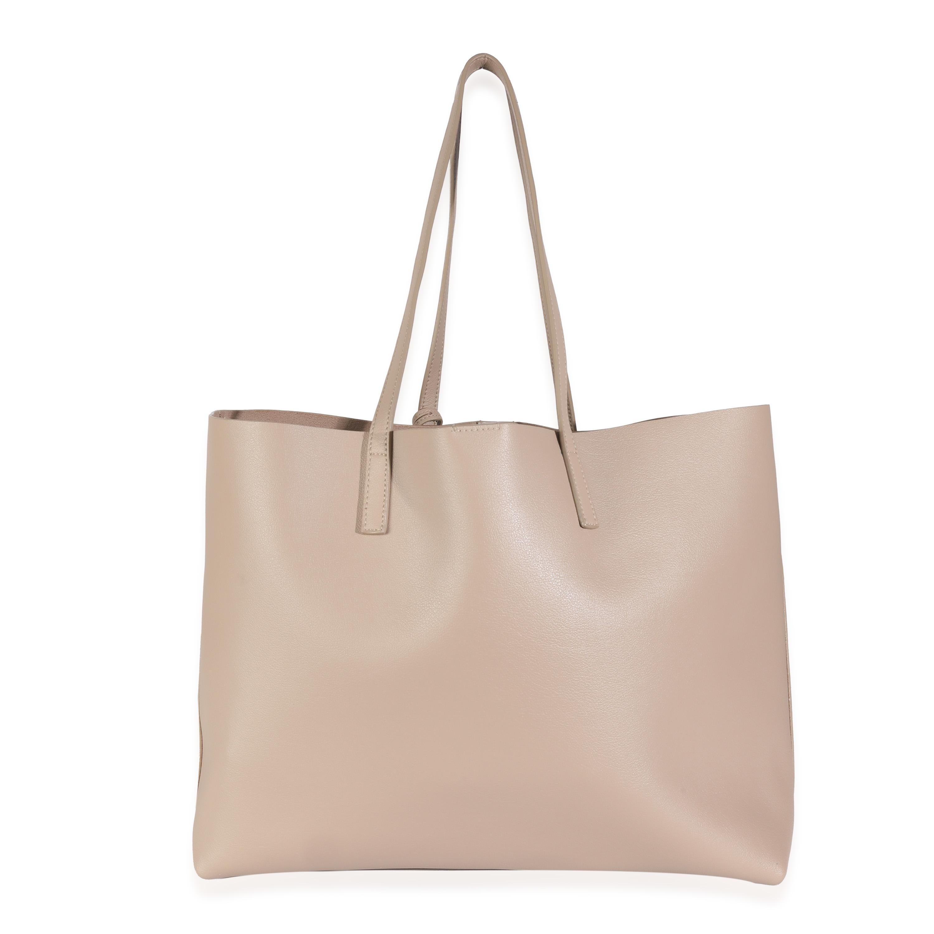 Listing Title: Saint Laurent Dark Beige Calfskin Large Shopping Tote
SKU: 144547
MSRP: 1500.00 USD
Condition: Pre-owned 
Handbag Condition: Excellent
Condition Comments: Item is in excellent condition and displays light signs of wear. Minor scuffing