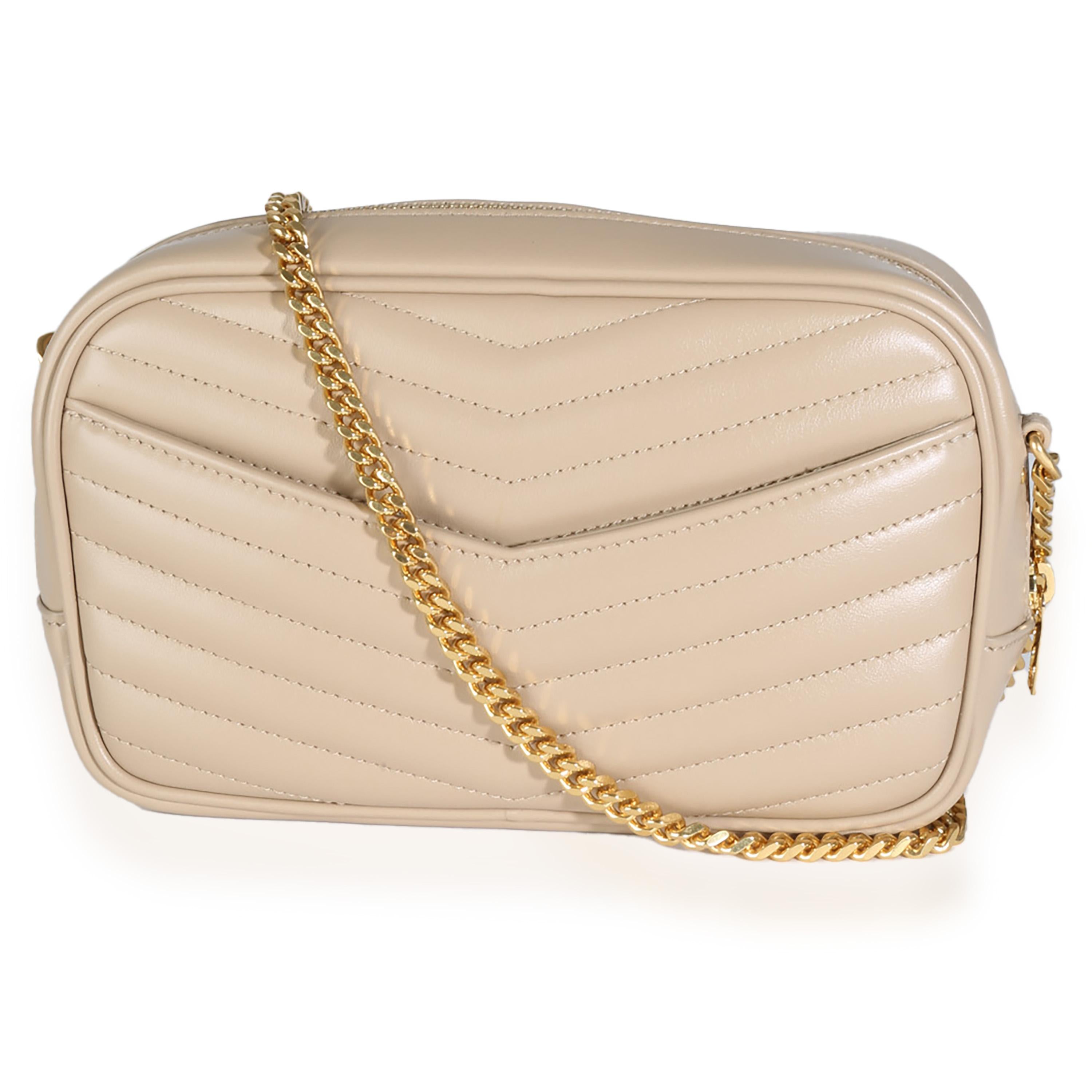 Listing Title: Saint Laurent Dark Beige Chevron Calfskin Mini Lou Crossbody Bag
SKU: 144882
MSRP: 1550.00 USD
Condition: Pre-owned 
Condition Description: Named after Loulou de la Falaise, the Loulou bag from Saint Laurent is an ode to one of the