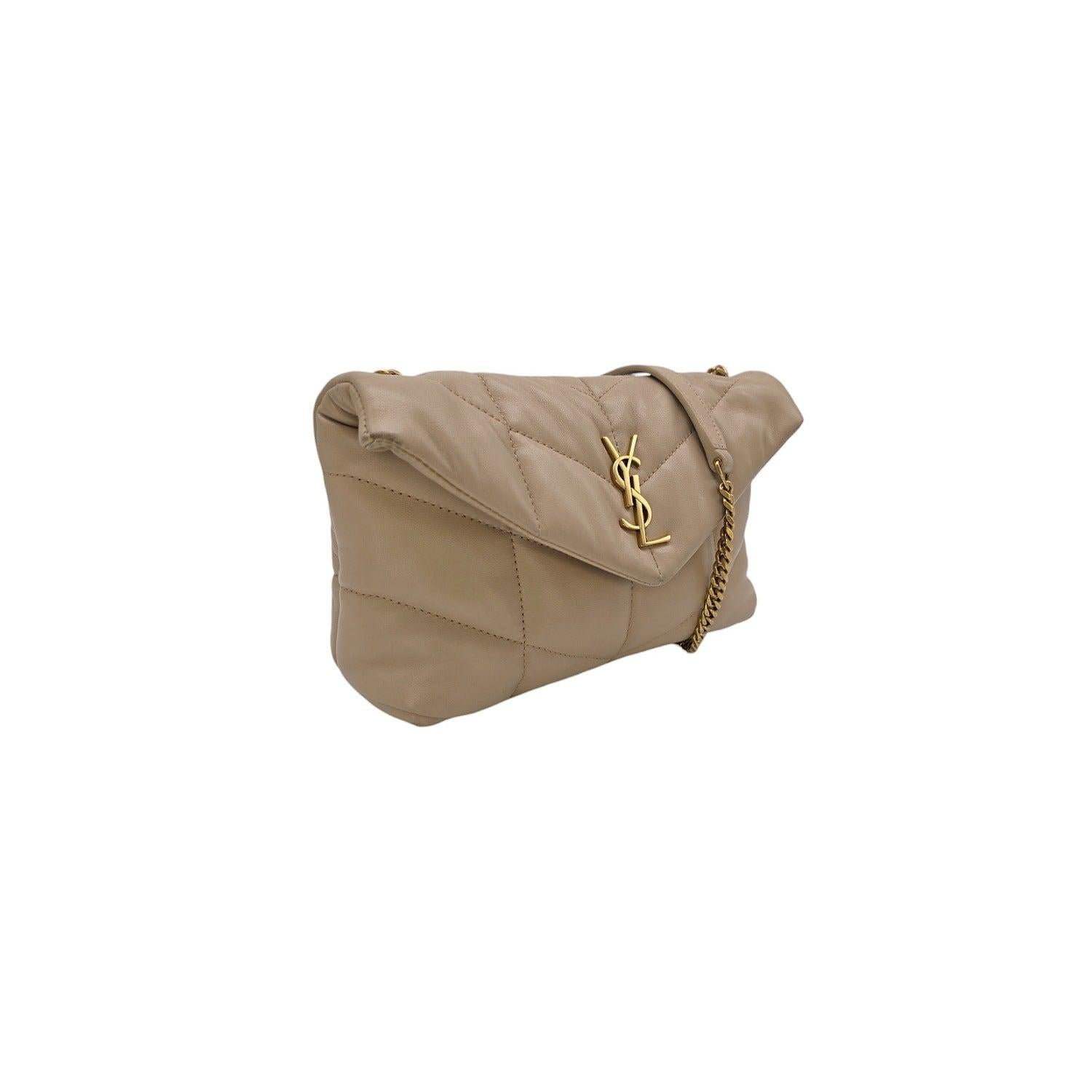 From the 2021 Collection by Anthony Vaccarello. Introducing the Saint Laurent Loulou Small Quilted Leather Shoulder Bag: a practical and stylish choice for any occasion. Made in Italy, this bag features the iconic chevron quilting, light bronze
