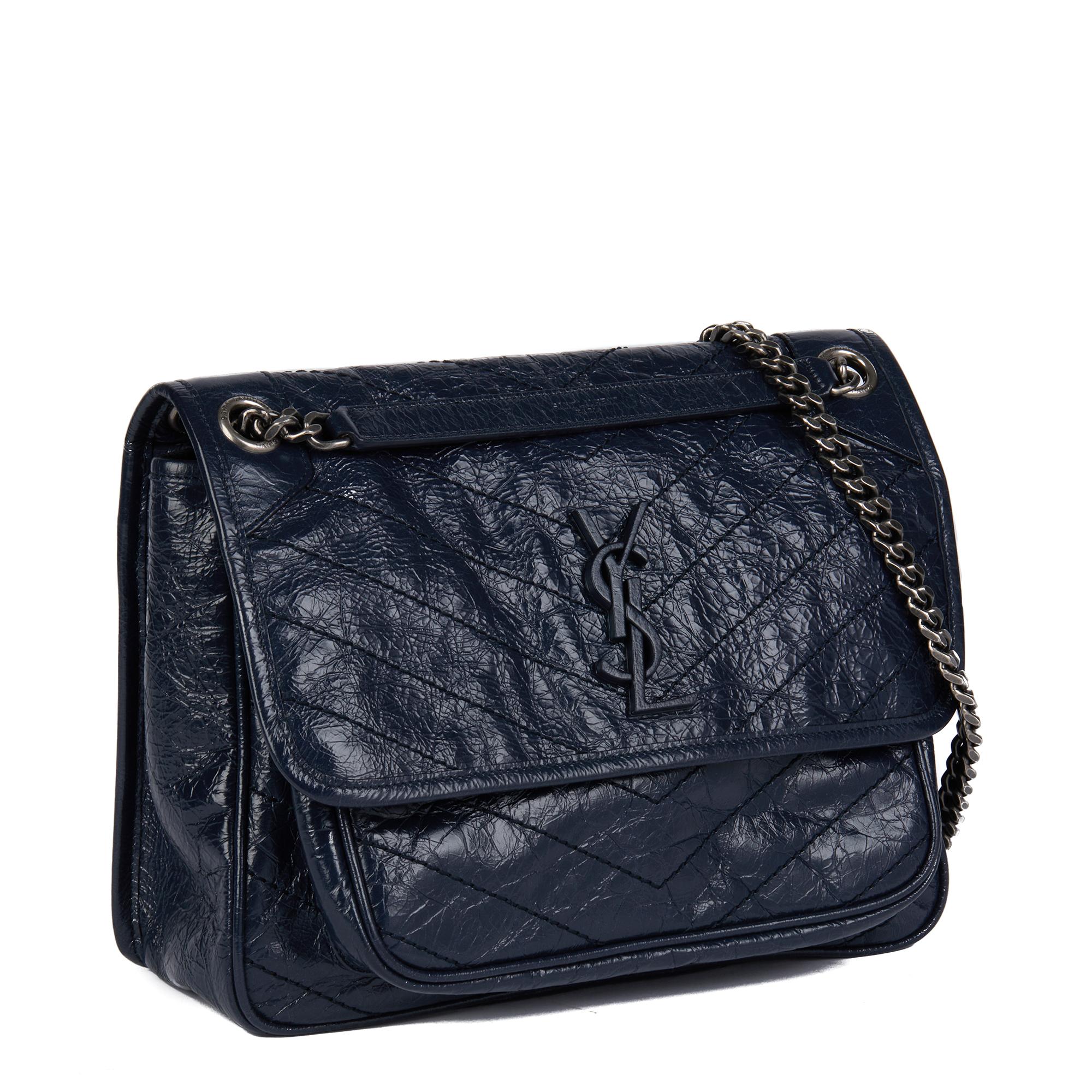 SAINT LAURENT
Deep Marine Chevron Quilted Crinkled Calfskin Leather Medium Niki

Xupes Reference: CB752
Serial Number: PMR498894-0718
Age (Circa): 2018
Accompanied By: Saint Laurent Dust Bag, Box, Tag, Care Booklet
Authenticity Details: Serial Stamp