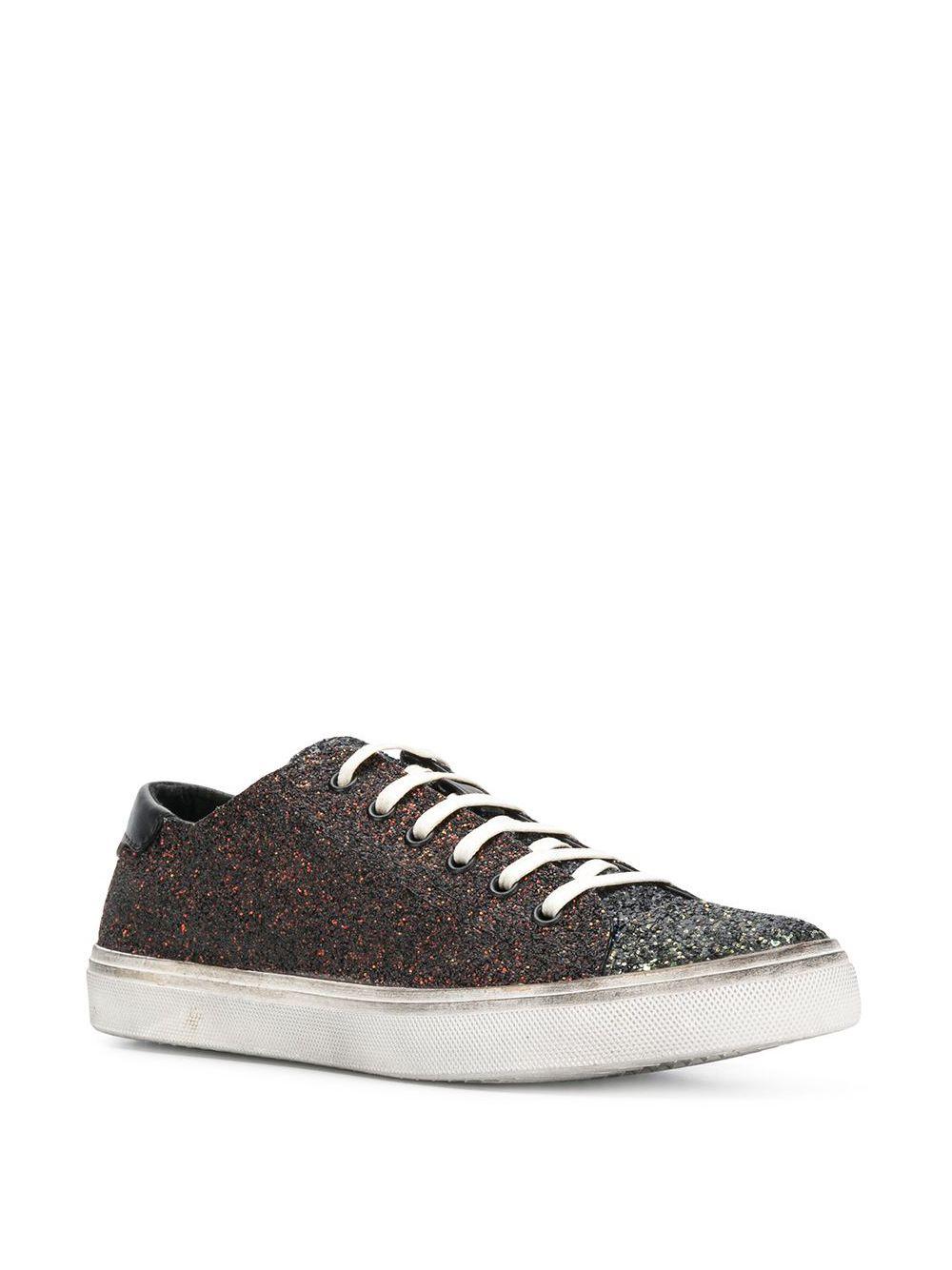 Saint Laurent Distressed Low Top Multicolor Glitter Bedford Sneakers

Founded in 1961 by innovative designer Yves Saint Laurent, French luxury fashion house Saint Laurent fuses expert craftsmanship with the label’s signature rock ‘n’ roll flair.