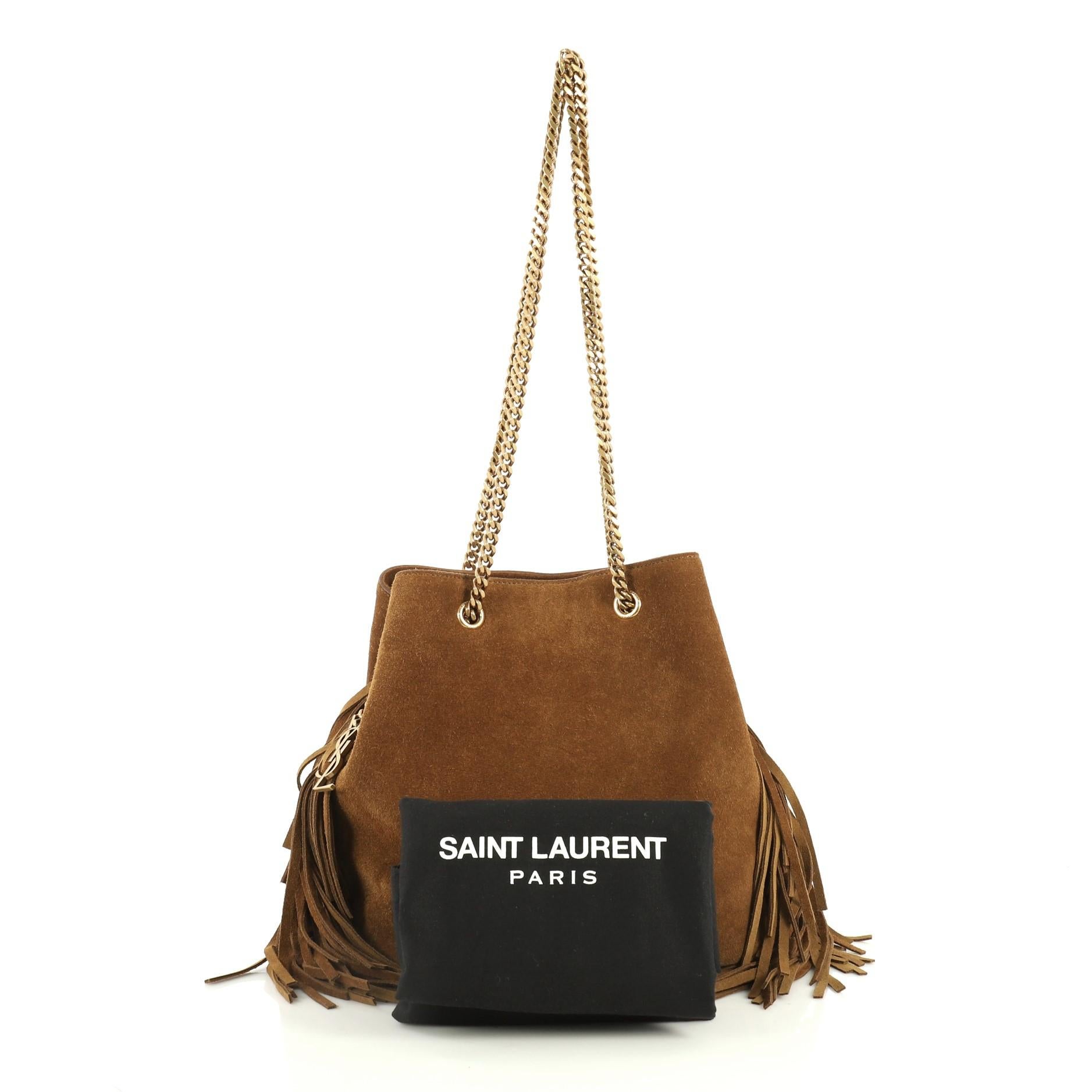 This Saint Laurent Emmanuelle Chain Bucket Bag Fringe Suede Small, crafted in brown suede, features chain-link handles, interlocking YSL metal charm and aged gold-tone hardware. It opens to a brown suede interior. 

Estimated Retail Price: