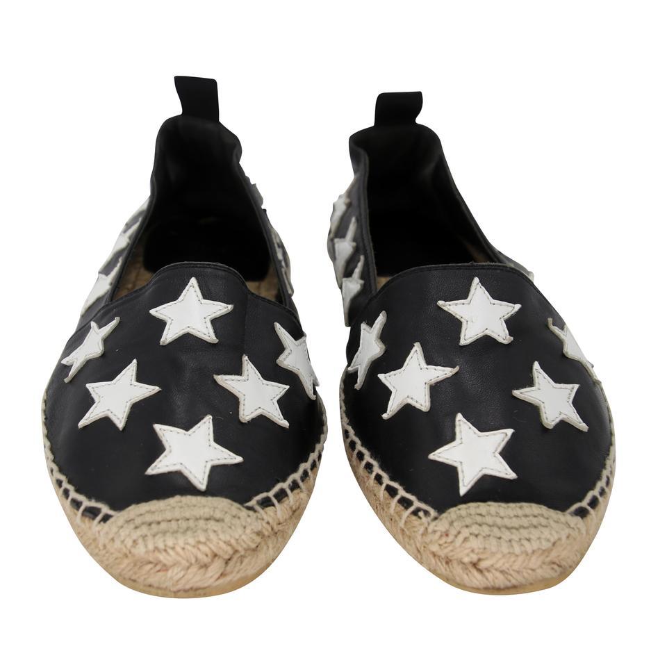 Saint Laurent Espadrille 40 Leather Velvet Stars Flats SL-0402N-0108

These trendy Saint Laurent Espadrille Flats can enhance any style. These chic flats feature white leather with black velvet stars throughout. These flats include the signature