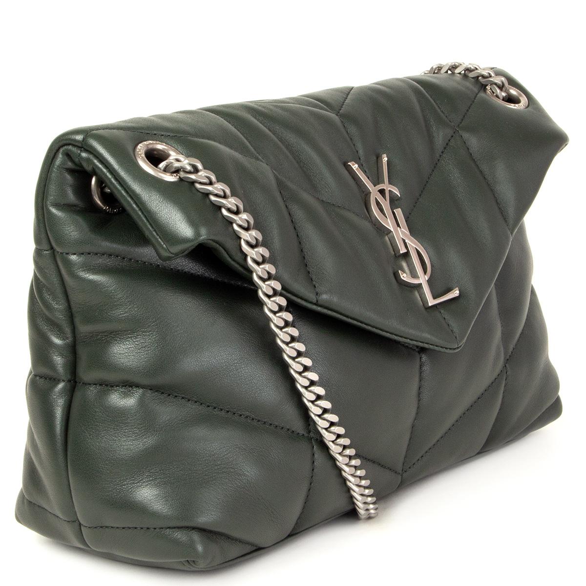 100% authentic Saint Laurent Small Puffer shoulder bag in moss green quilted lambskin featuring silver-tone YSL initials and chain strap. Opens with a magnetic snap fastening and is lined in black grosgrain fabric with one zipper pocket against the