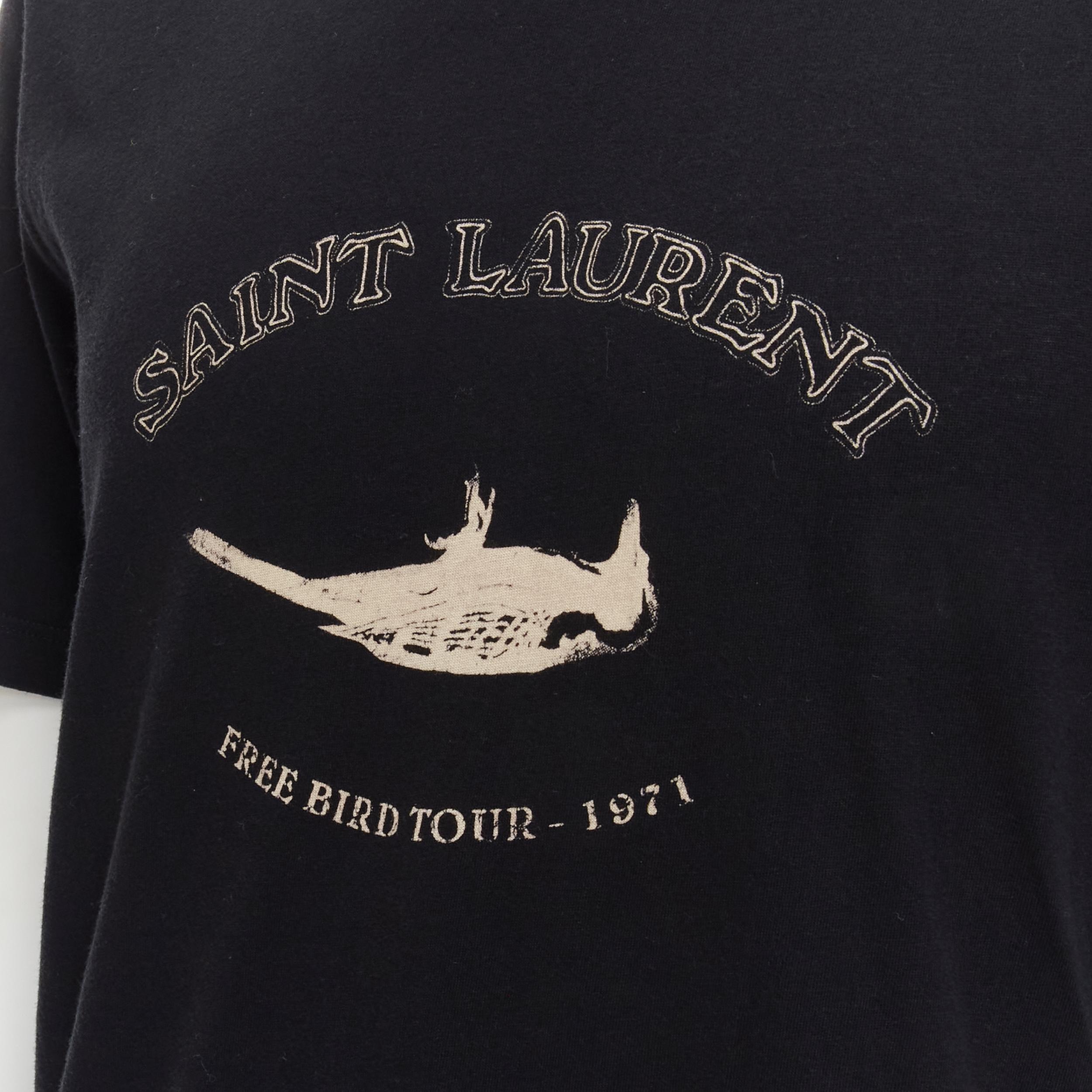 SAINT LAURENT Free bird Tour 1971 black cotton tshirt XS 
Reference: INYG/A00003 
Brand: Saint Laurent 
Material: Cotton 
Color: Black 
Pattern: Solid 
Estimated Retail Price: US $290 
Made in: France 

CONDITION: 
Condition: Excellent, this item