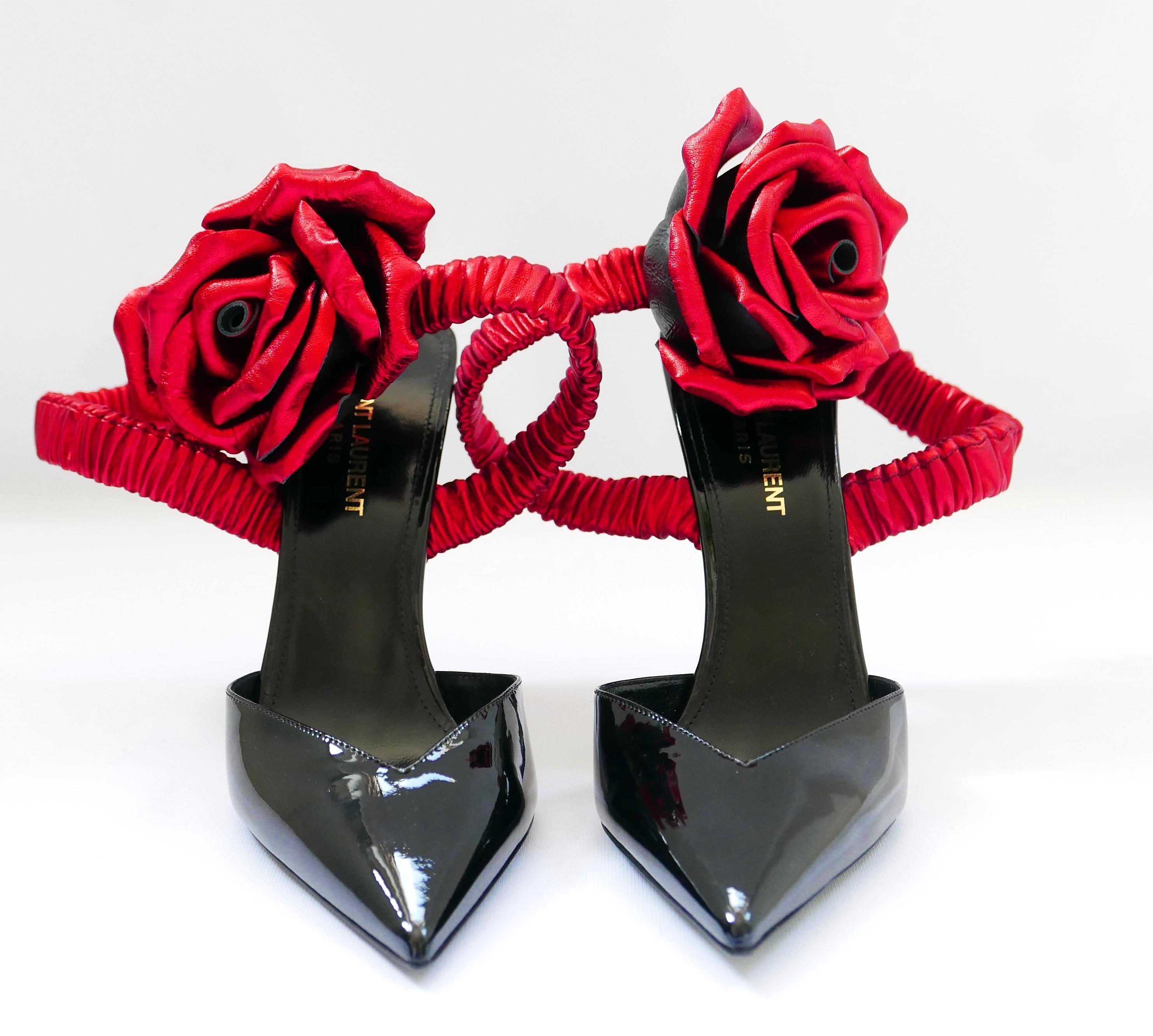 Stunning Saint Laurent Freja Rose 105 heels from the Fall 2017 runway. Look 50. Bought for £1455 and are unworn with sticker to base and large, lined layer dustbag. Superbly crafted from black patent-leather with metallic red leather elasticated