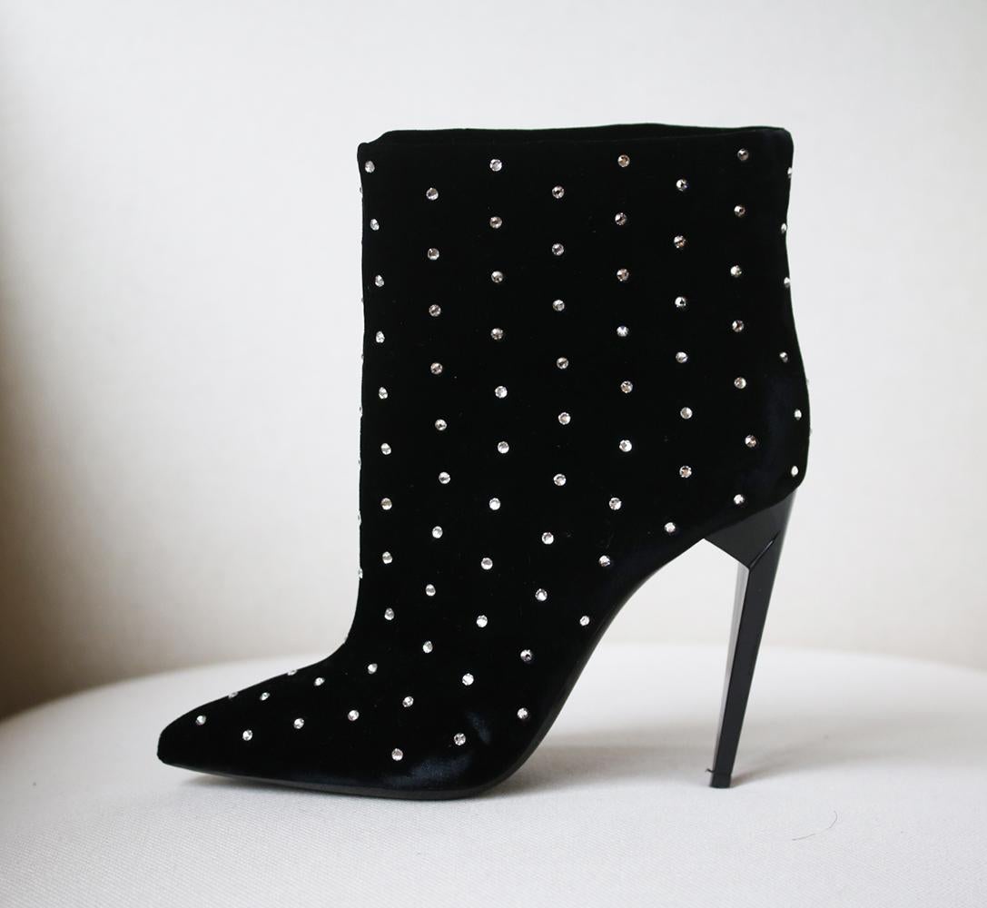 Saint Laurent's 'Freja' boots shot to the top of our wish list the moment we saw them. Made in Italy, they're crafted from plush black velvet adorned with silver studs. Heel measures approximately 110mm/ 4.5 inches. Black velvet. Pull on. Made in