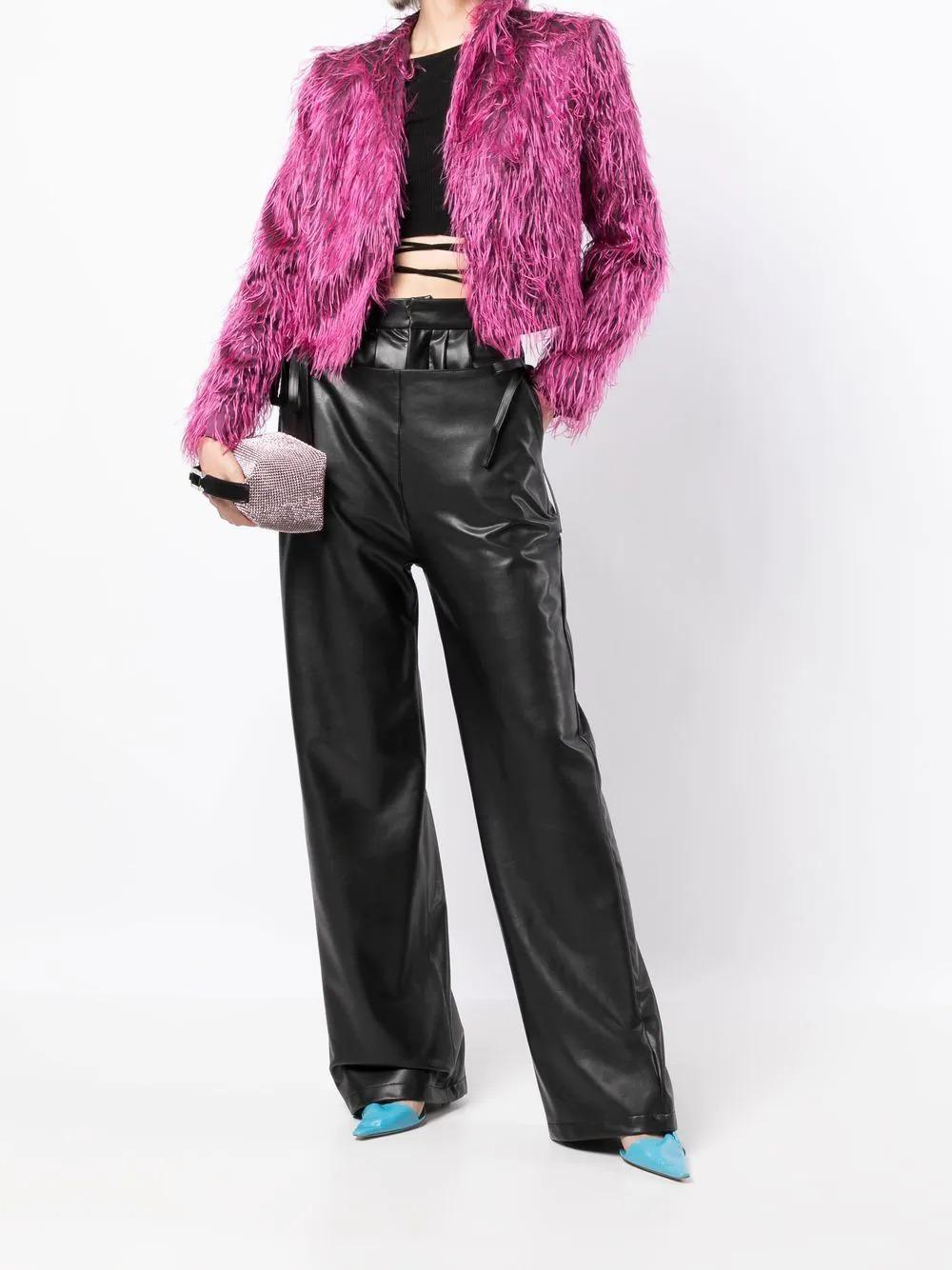 The perfect layering piece, add a touch of dramatic flair to your outfit with this vintage pre-owned shaggy faux fur jacket from Saint Laurent. Designed with a cropped fit, pair with jeans and sneakers to dress up a casual look or throw over an