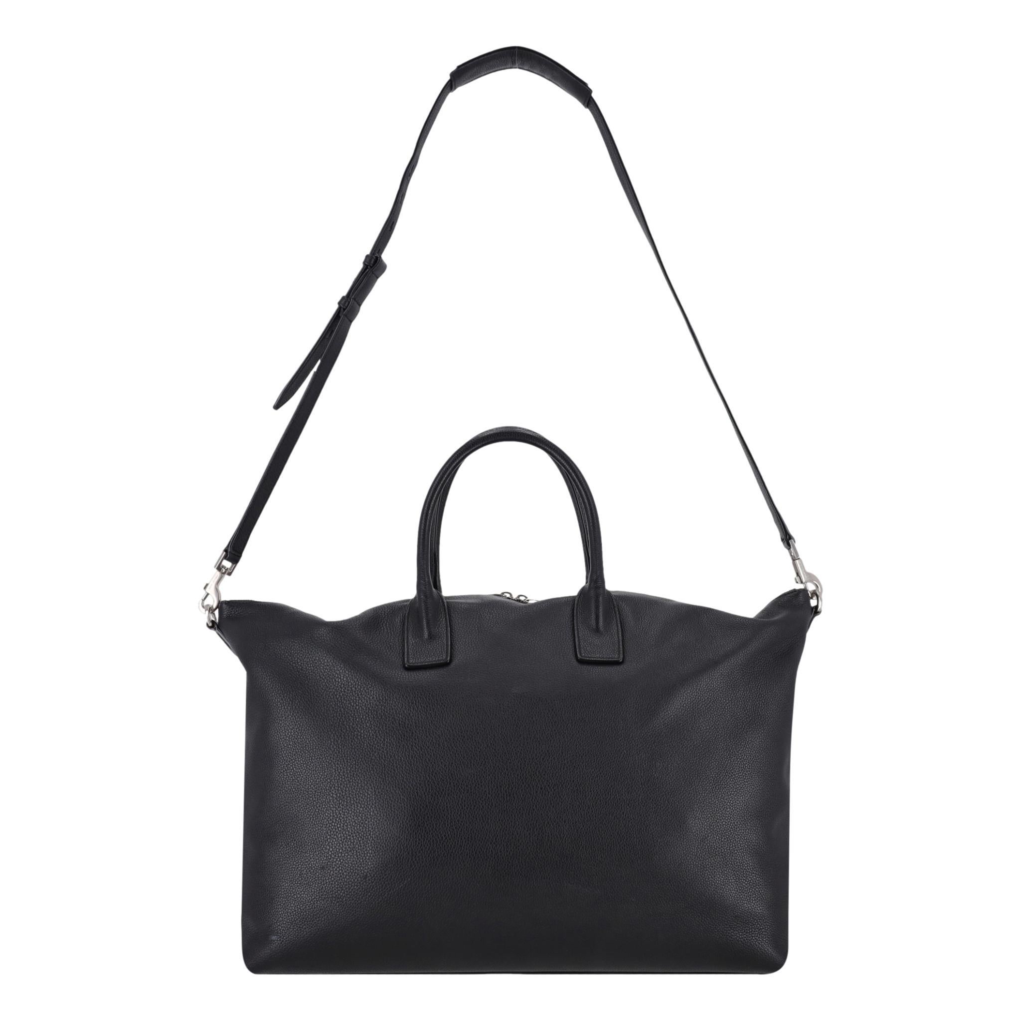 Saint Laurent Giant Leather Bowling Tote Bag

Black bowling bag crafted from grained calfskin leather.

Featuring dual rolled top handles and detachable, adjustable shoulder strap.

Silver, branded hardware and double zipped top leading to spacious