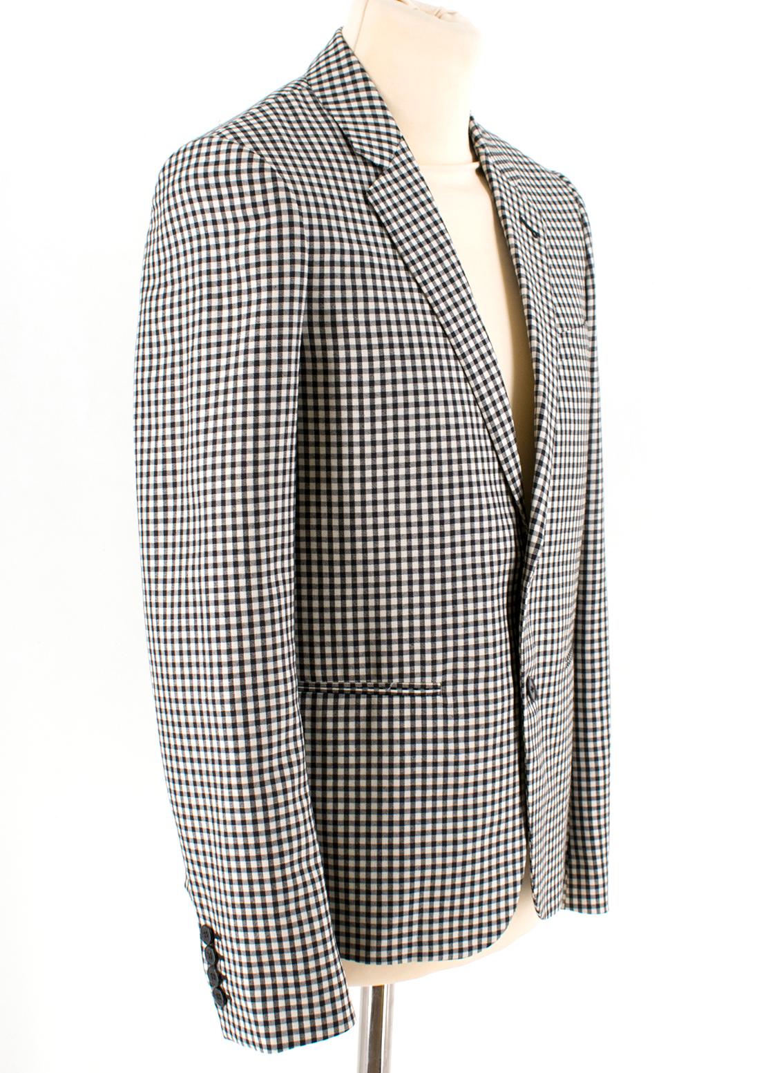 Saint Laurent Gingham Double Breasted Blazer 

Gingham pattern blazer jacket, 
Double-breasted with front button fastening,
Slightly padded shoulders,
Four buttons along the cuffs,
Notched collar,
Long sleeves,
Slit along the hem,
Lightweight