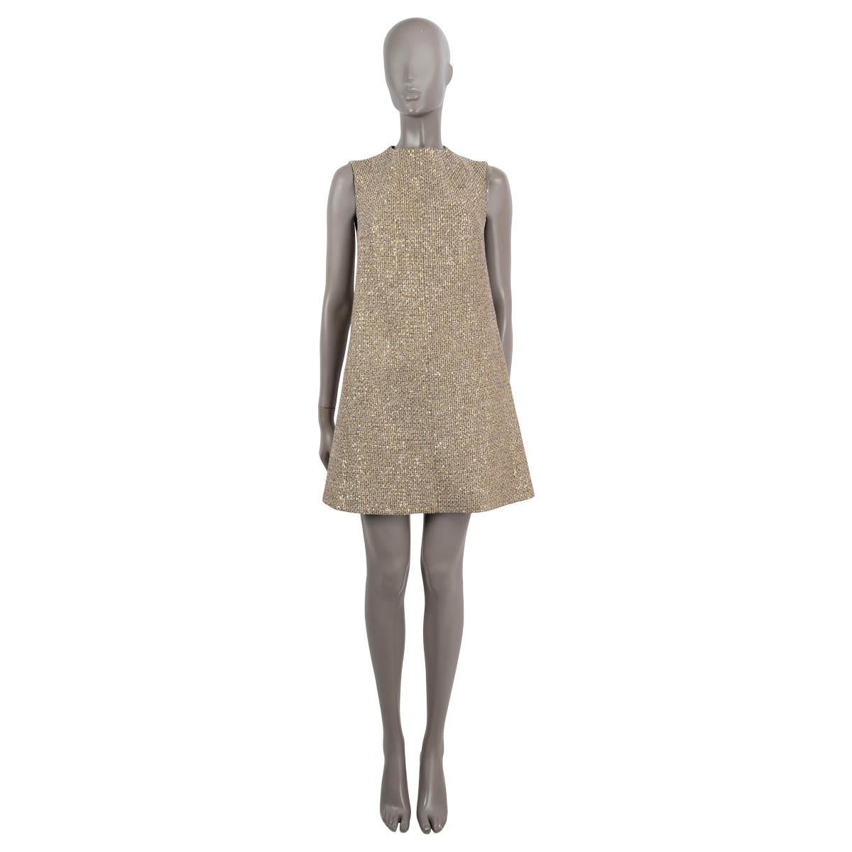 100% authentic Saint Laurent lurex tweed dress in beige, black, ivory and gold polyester (55%), polyamide (19%), viscose (15%), cotton (5%), acrylic (4%) and wool (2%). Adorned with sequins throughout, this dress features an A-line silhouette, round