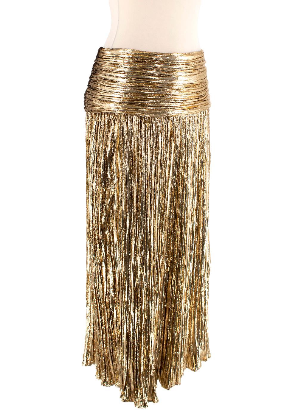 Saint Laurent Gold Lame Pleated Midi Skirt

- Metallic gold lame with plisse pleating
- Swag waistband
- Concealed side zip

Materials 
77% Fibre 
23% Silk 
Lining 
100% Silk 

Made in Italy 
Dry Clean Only 

PLEASE NOTE, THESE ITEMS ARE PRE-OWNED