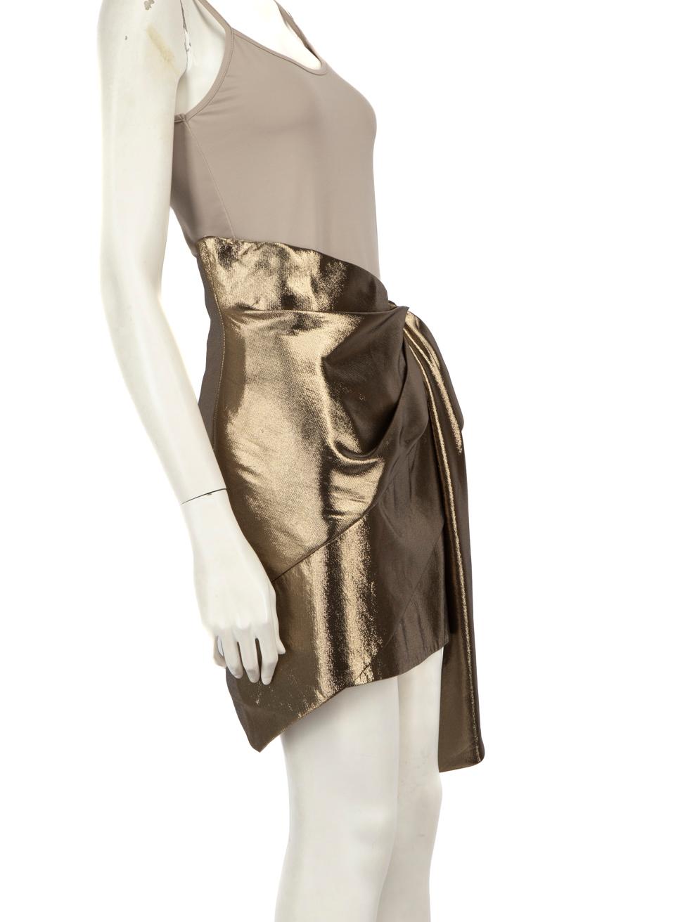 CONDITION is Very good. Minimal wear to the skirt is evident. Pluck to the weave on the back of this used Saint Laurent designer resale item.
 
 
 
 Details
 
 
 Gold
 
 Silk
 
 Skirt
 
 Mini
 
 Asymmetric hem
 
 Bow detail
 
 Side zip fastening
 
