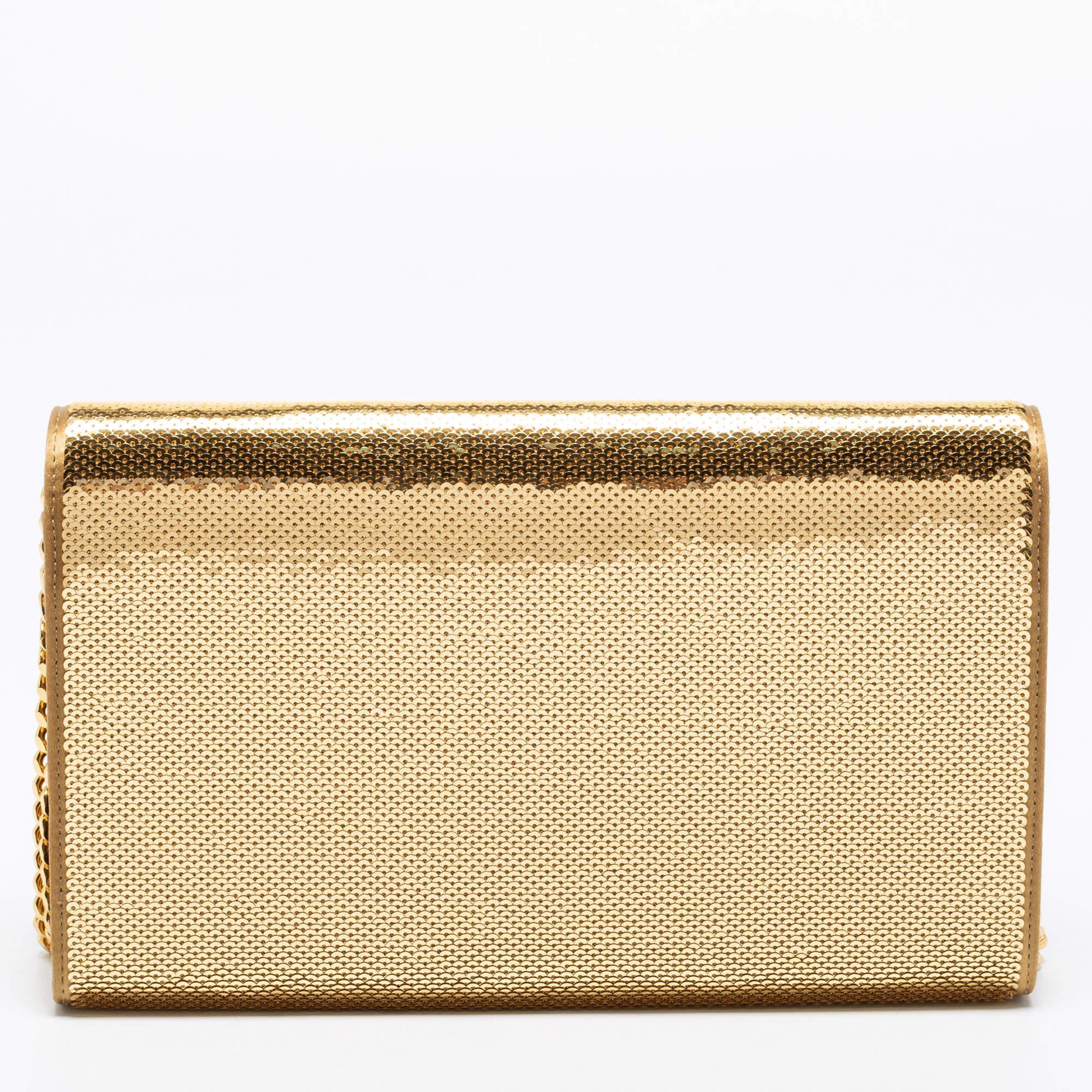 Meticulously crafted from sequins and satin, this Saint Laurent wallet on chain exudes just the right amount of glamour. It features a sturdy gold-tone shoulder chain, the YSL logo on the front flap, and a leather interior with compartments and