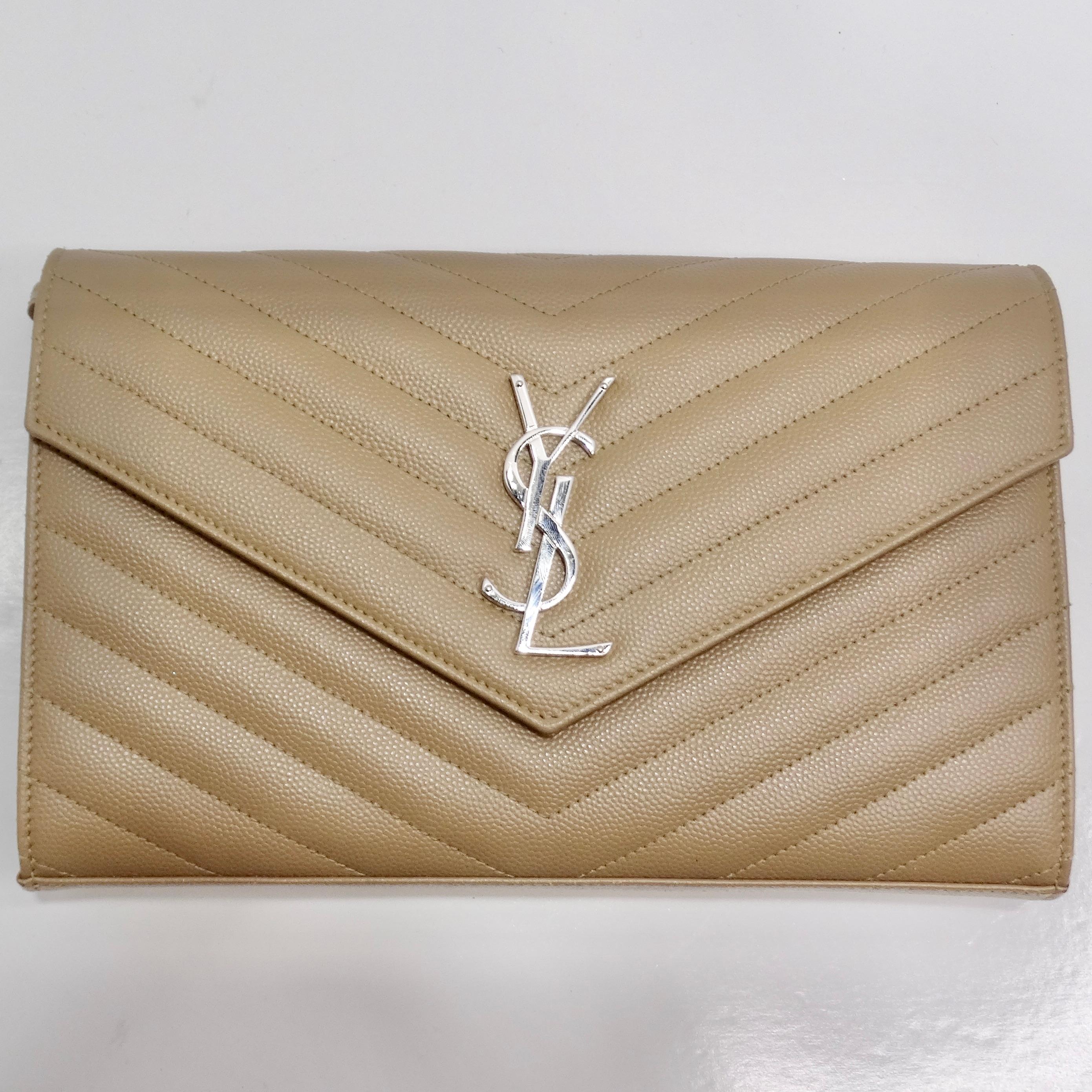 Introducing the epitome of elegance: the Saint Laurent Grain De Poudre Matelasse Chevron Quilted Chain Wallet. Crafted with meticulous attention to detail, this sophisticated accessory combines style and functionality seamlessly.

The wallet