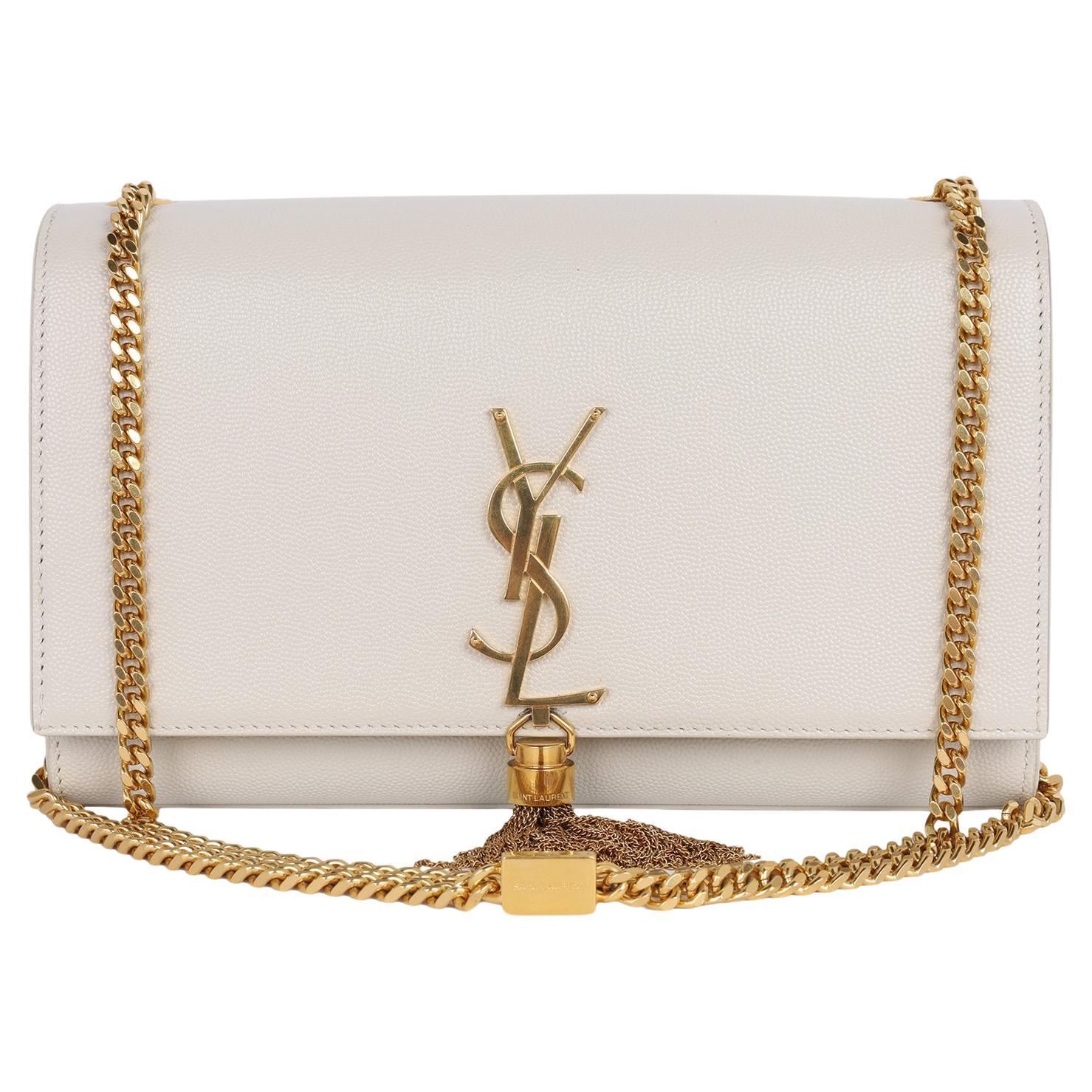 Authentic, pre-loved Saint Laurent YSL Grain De Poudre medium Classic Monogram Kate Tassel shoulder bag in Ivory. This classic bag is one that will take you through all seasons. Adorned with iconic 'YSL' gold hardware and tassel, leather body with a